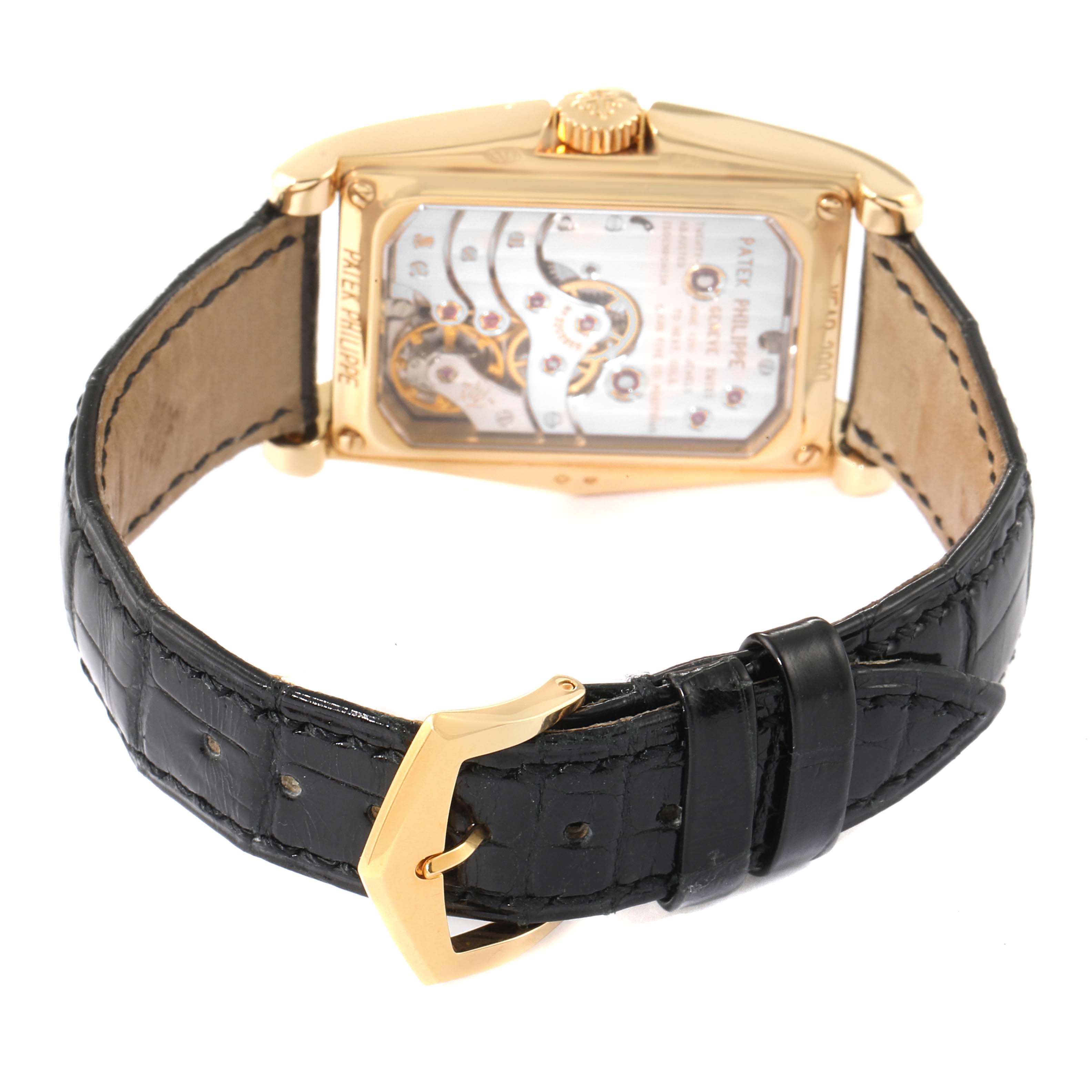 The image shows the back, movement, and strap of the Patek Philippe Gondolo 5100J Men's Yellow Gold Silver Dial 5100J Men's Yellow Gold Silver Dial watch at an angle highlighting its transparent case.