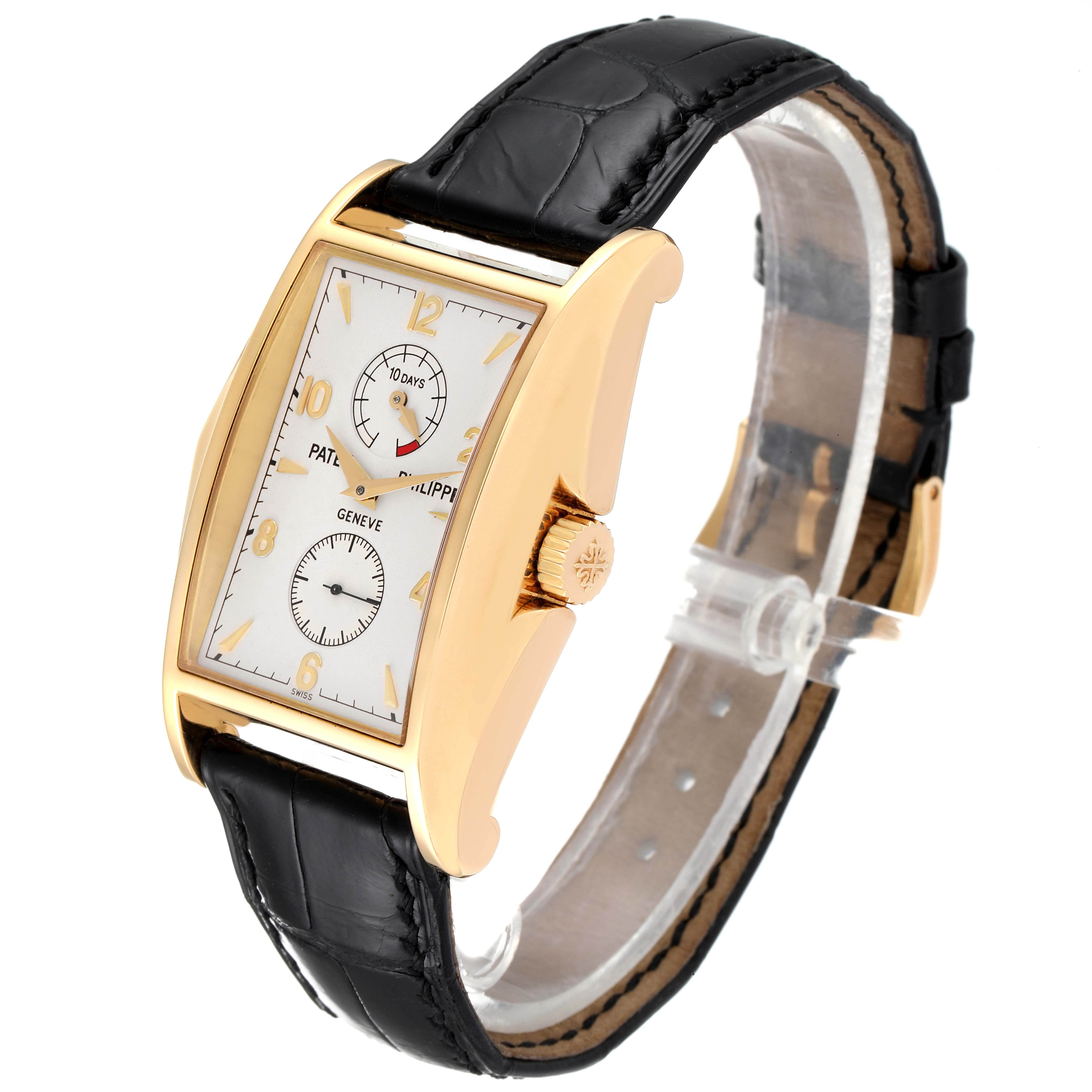 The Patek Philippe Gondolo 5100J Men's Yellow Gold Silver Dial 5100J Men's Yellow Gold Silver Dial watch is shown at a three-quarter angle, highlighting the face, strap, and side crown.