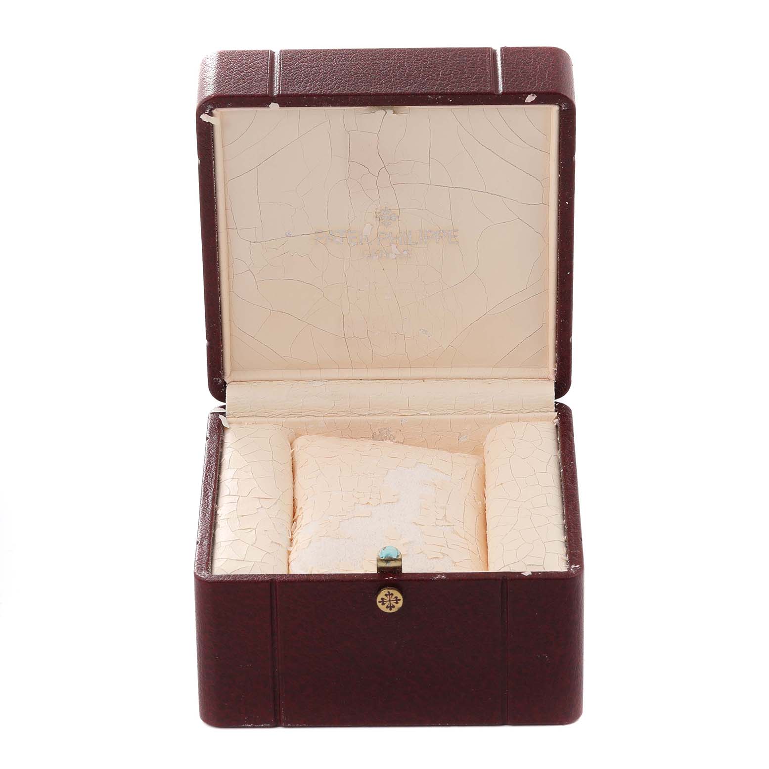This image shows an open watch box for a Patek Philippe Calatrava 5022R-010 Men's Rose Gold White Dial 5022R-010 Men's Rose Gold White Dial model, displaying its interior cushioning and logo.