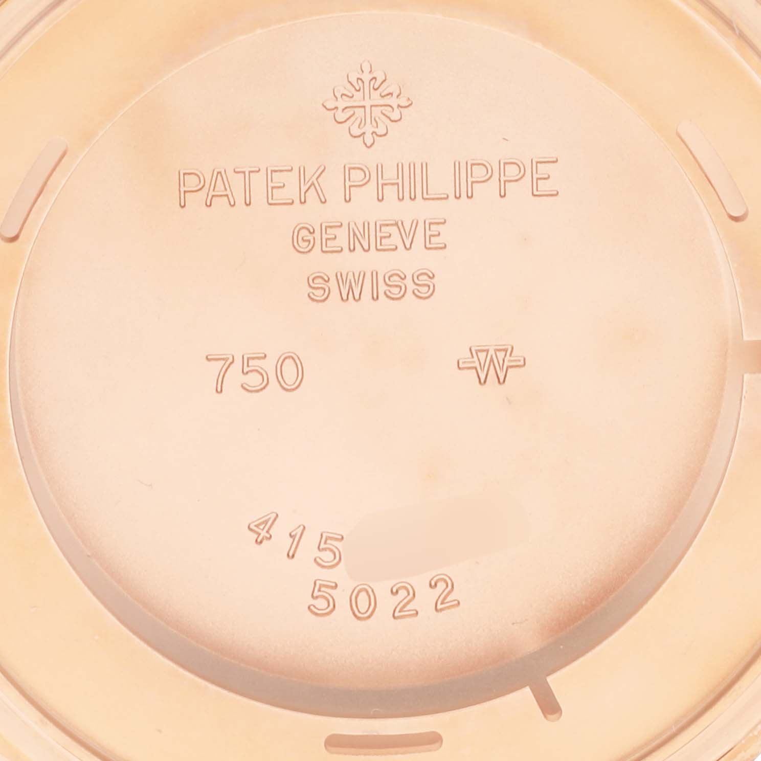 This image shows the back casing of a Patek Philippe Calatrava 5022R-010 Men's Rose Gold White Dial 5022R-010 Men's Rose Gold White Dial watch, displaying branding and model details.