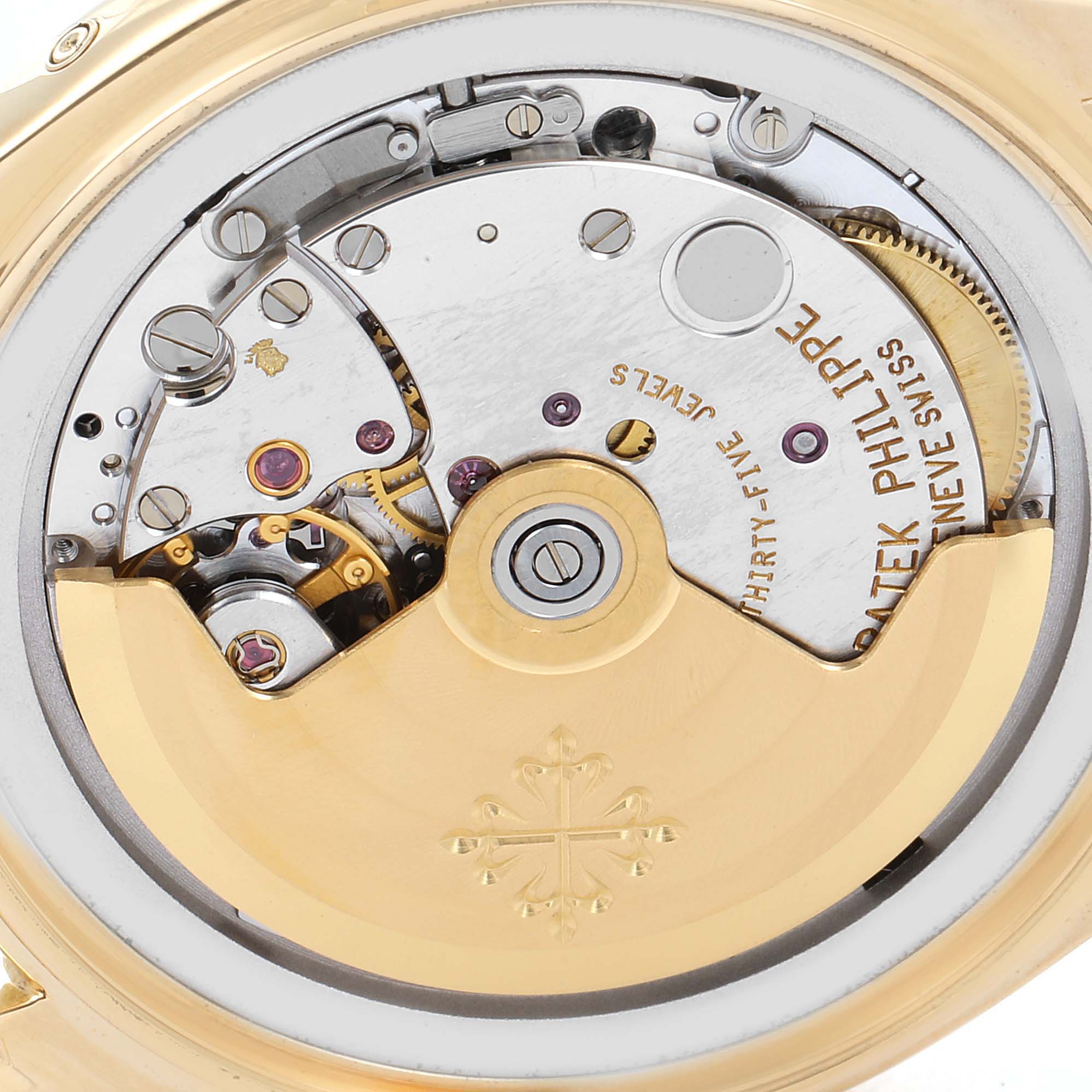This image shows the intricate back and movement of the Patek Philippe 5035 Men's Yellow Gold Silver Dial 5035 Men's Yellow Gold Silver Dial Complicated Annual Calendar Yellow Gold Men's Watch 5035 model.