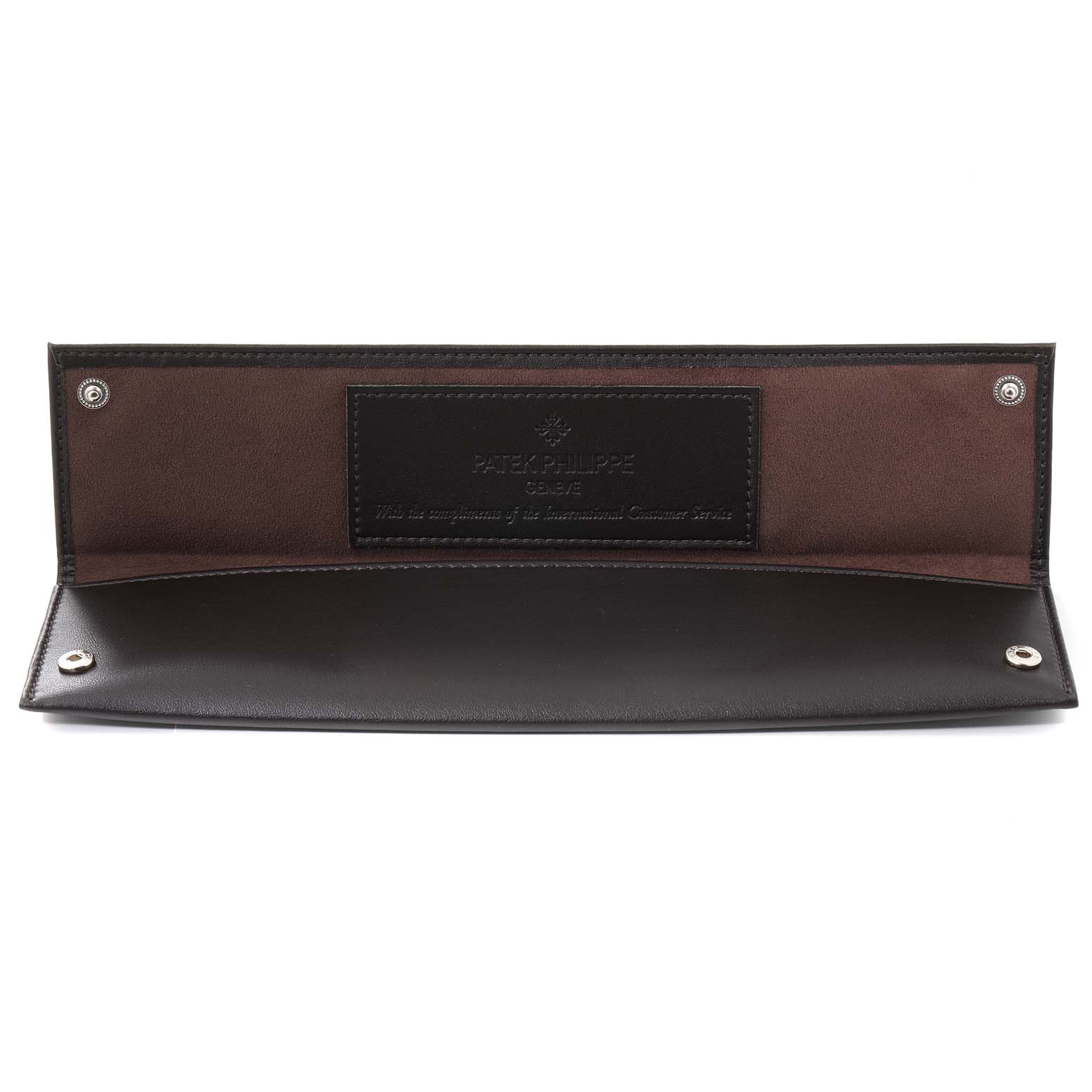 This image shows an open leather pouch for a Patek Philippe 5035 Men's Yellow Gold Silver Dial 5035 Men's Yellow Gold Silver Dial Complicated Annual Calendar Yellow Gold Men's Watch 5035.