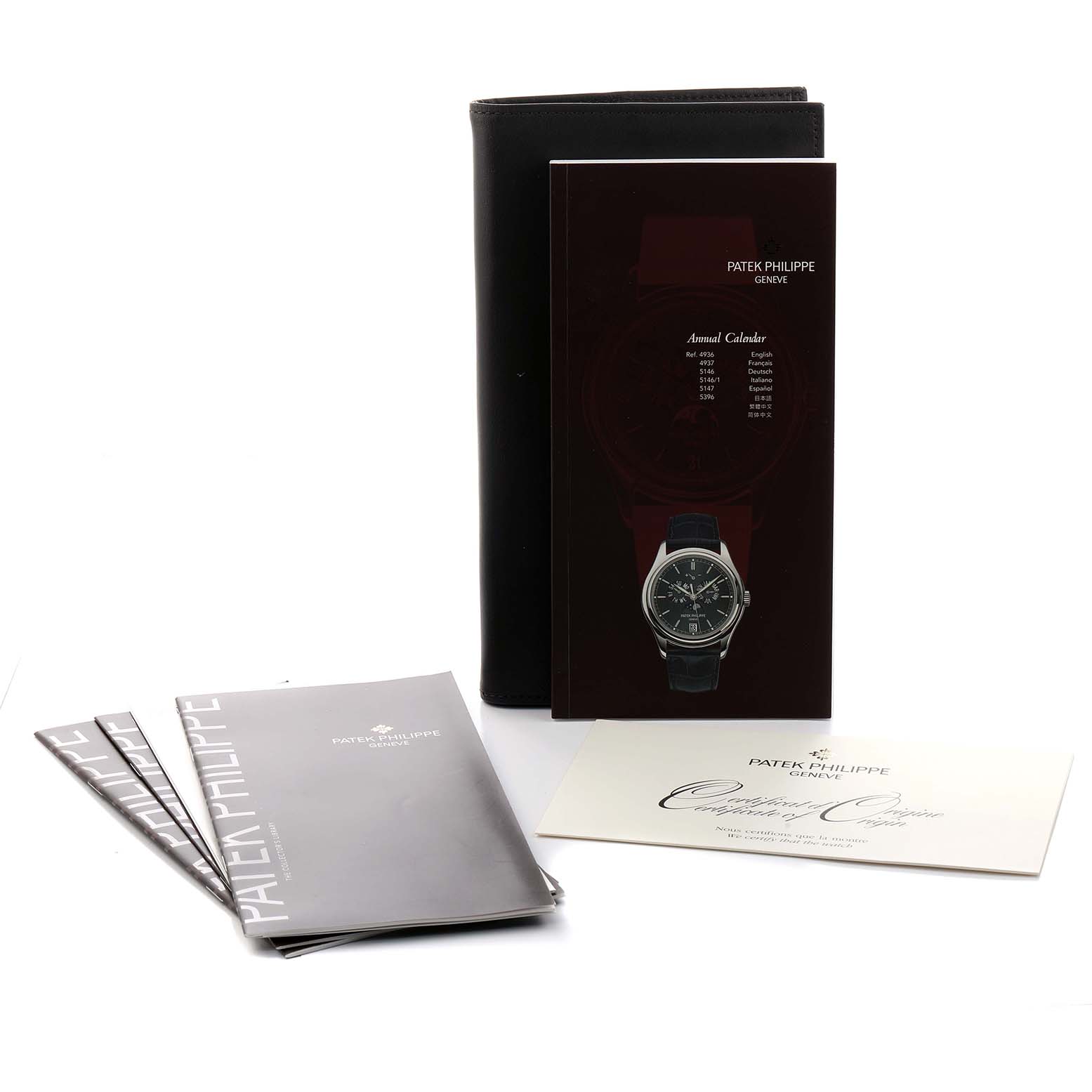 The image shows Patek Philippe Complications 5146J Men
s Yellow Gold Beige Dial model booklets and a certificate, all laid flat.