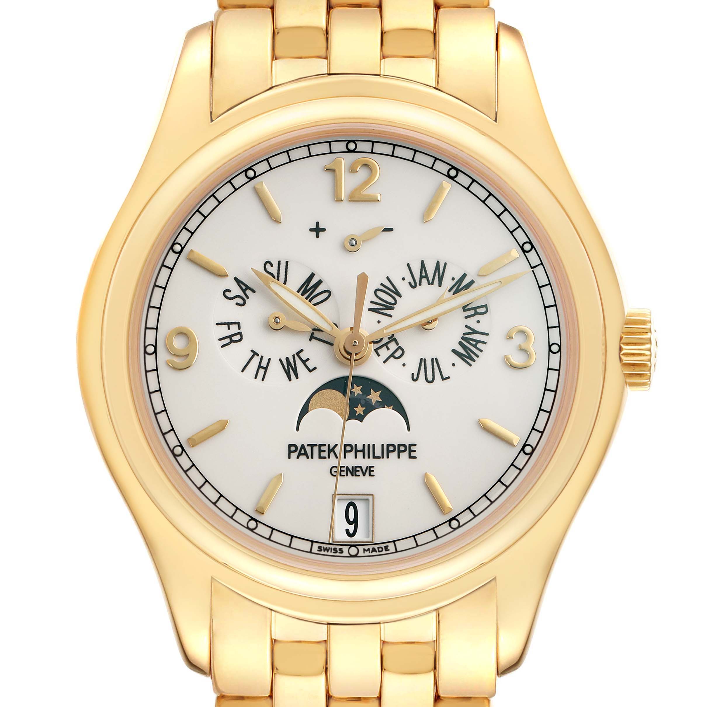The Patek Philippe Complications 5146J Men
s Yellow Gold Beige Dial watch is shown from a top-down angle, highlighting its face, indices, hands, and moon phase.