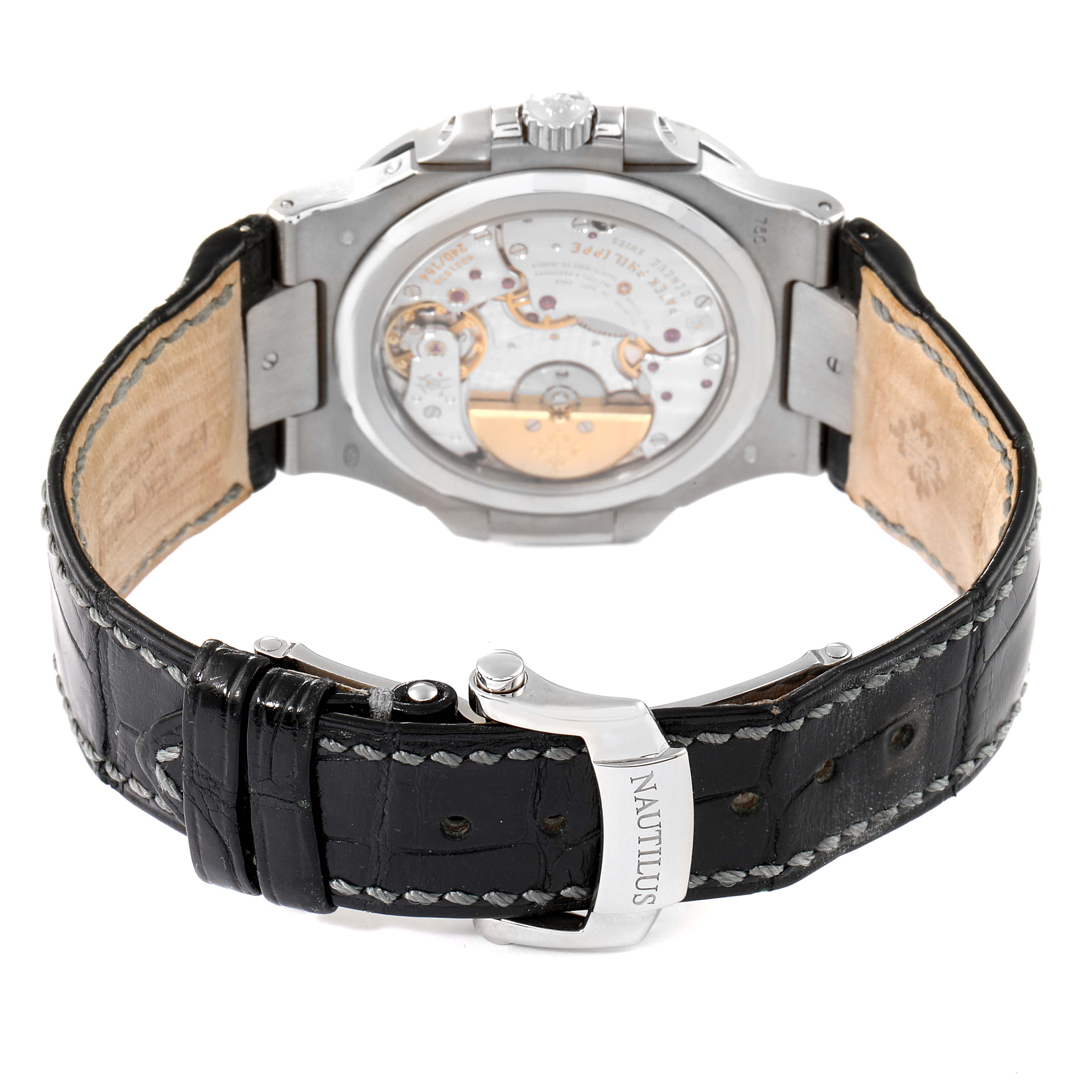 The image shows the back view of a Patek Philippe Nautilus 5712G/001 Men's White Gold Grey Dial 5712G/001 Men's White Gold Grey Dial watch, focusing on the movement and leather strap with the Nautilus branding.