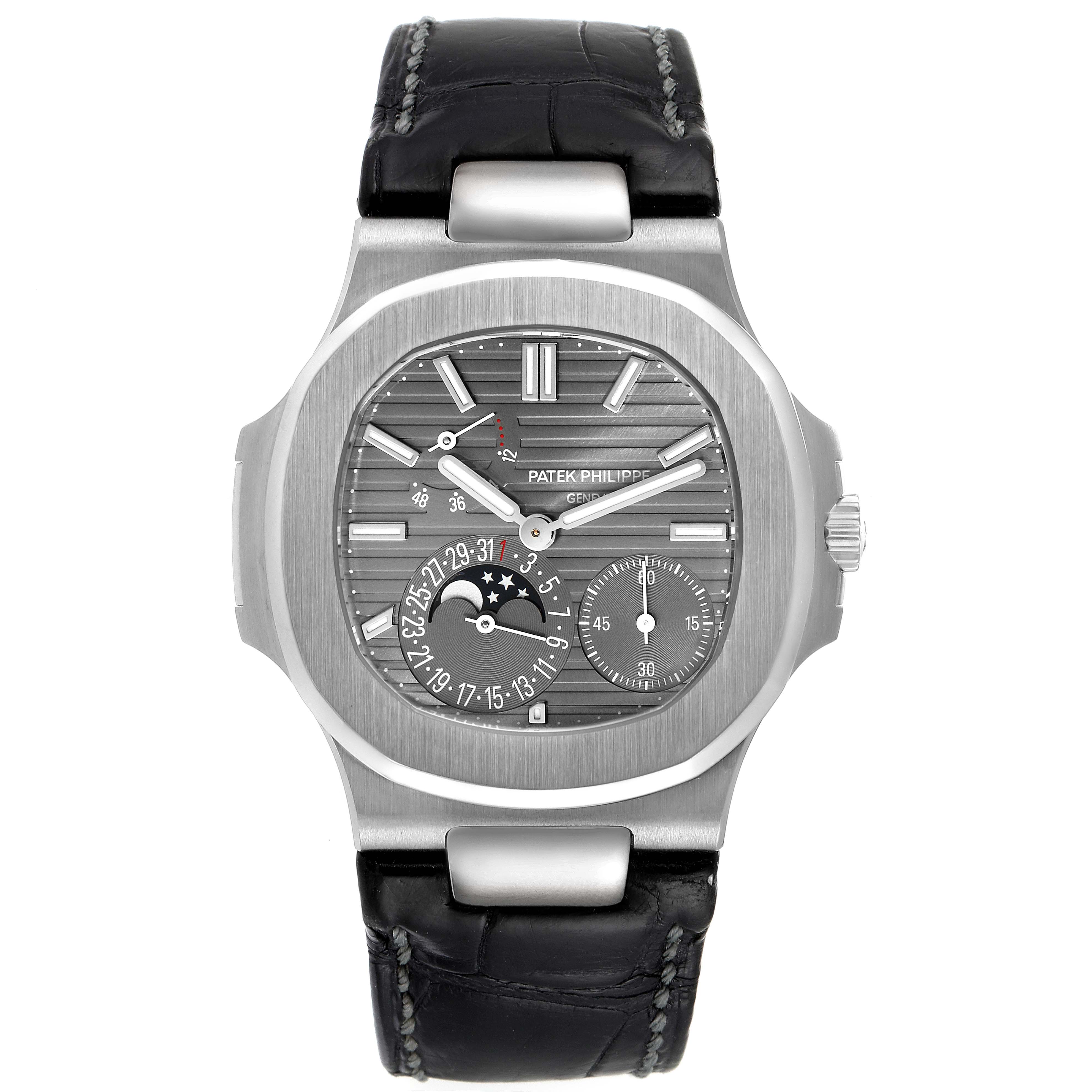 This is a front view of the Patek Philippe Nautilus 5712G/001 Men's White Gold Grey Dial 5712G/001 Men's White Gold Grey Dial watch, showcasing its dial, case, and leather strap.