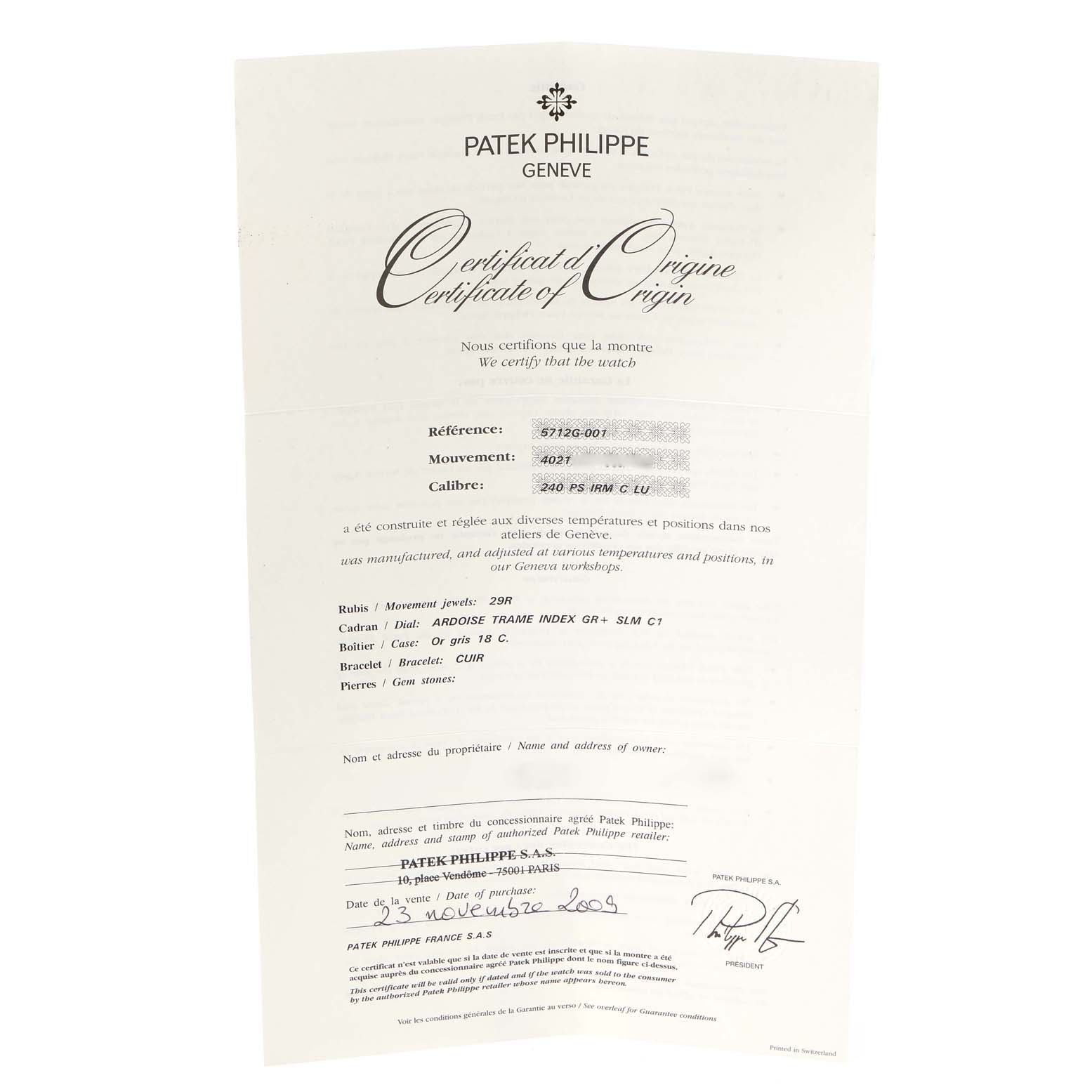 The image shows the Certificate of Origin for a Patek Philippe Nautilus 5712G/001 Men's White Gold Grey Dial 5712G/001 Men's White Gold Grey Dial watch, taken from a top-down angle.