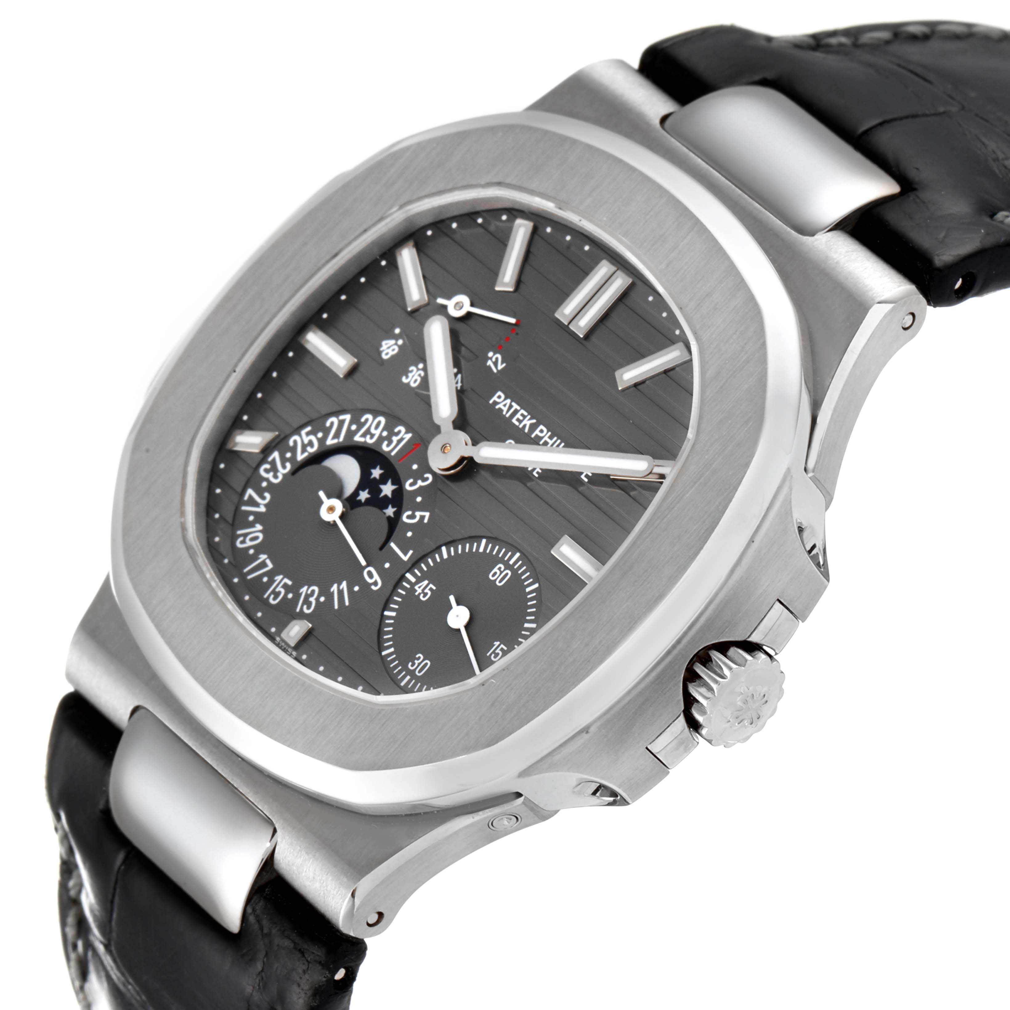 This image shows a close-up angled side view of the Patek Philippe Nautilus 5712G/001 Men's White Gold Grey Dial 5712G/001 Men's White Gold Grey Dial watch, highlighting the crown, case, strap, and detailed dial.