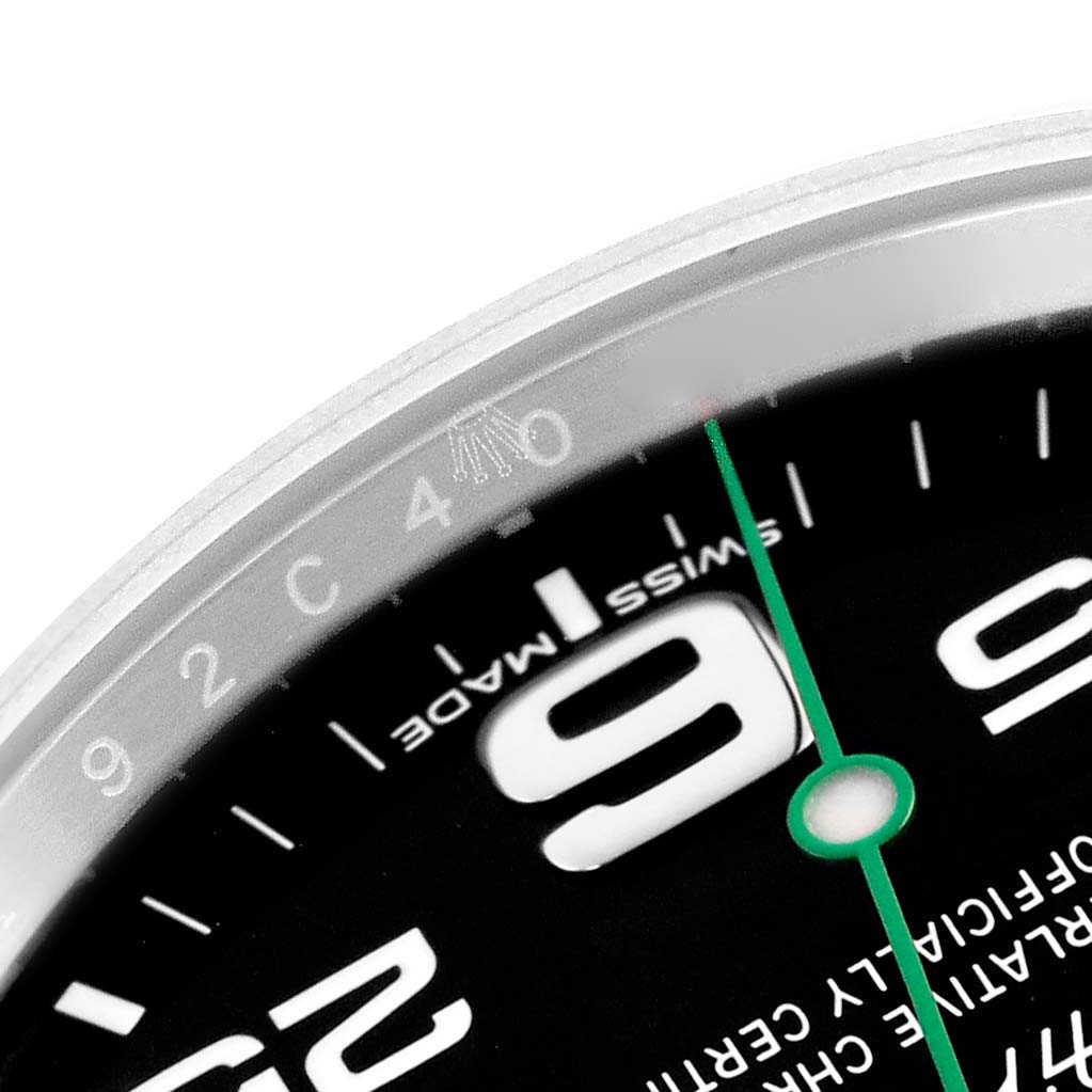 The image shows a close-up of the Rolex Air-King 116900 Men
s Stainless Steel Black Dial watch dial, highlighting the large number "9," green second hand, and "Swiss Made."
