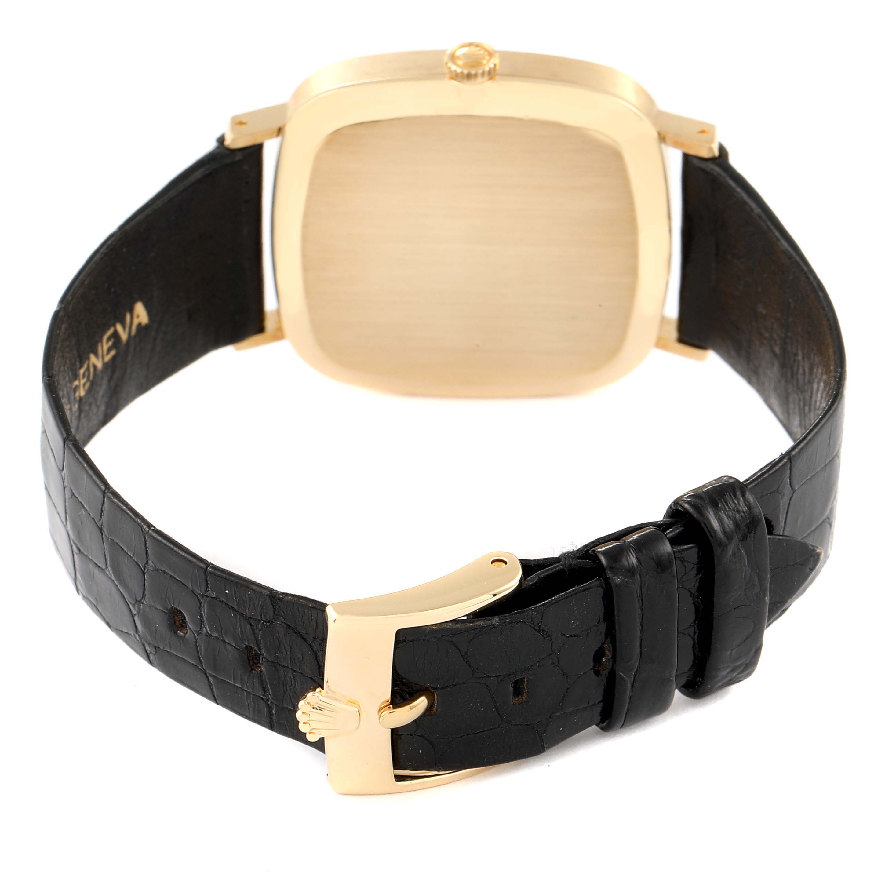 The image shows the back view of a Rolex Cellini 4114 Men's Yellow Gold Silver Dial 4114 Men's Yellow Gold Silver Dial model watch, including its gold case and black leather strap with a gold buckle.