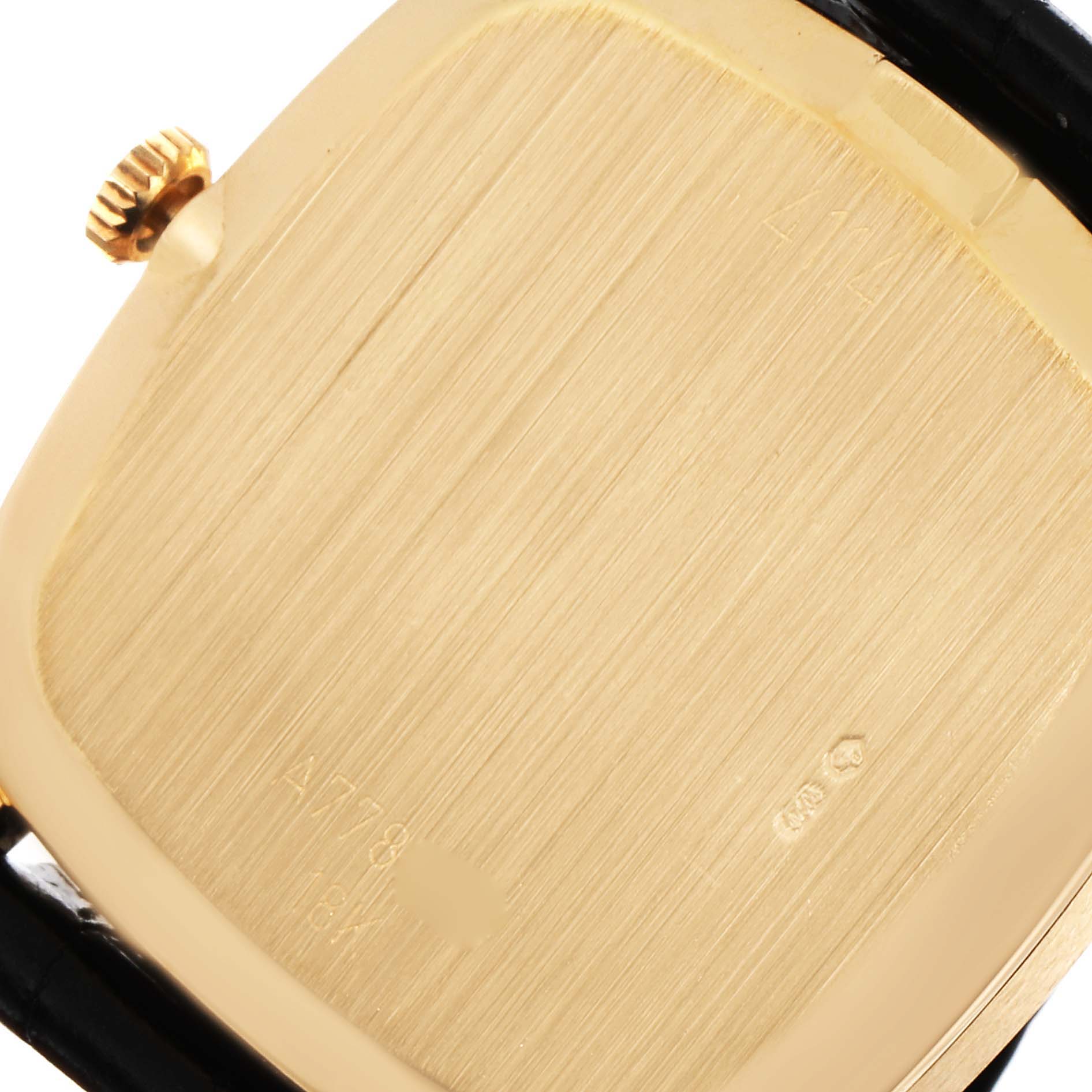 The image shows the back case and crown of a Rolex Cellini 4114 Men's Yellow Gold Silver Dial 4114 Men's Yellow Gold Silver Dial watch at a close-up angle.