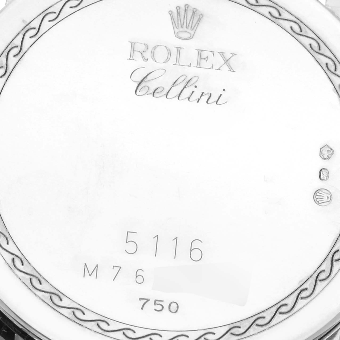 This close-up image shows the back casing of a Rolex Cellini 5116/9 Men's White Gold Mother of Pearl Dial 5116/9 Men's White Gold Mother of Pearl Dial watch with engravings and hallmarks.