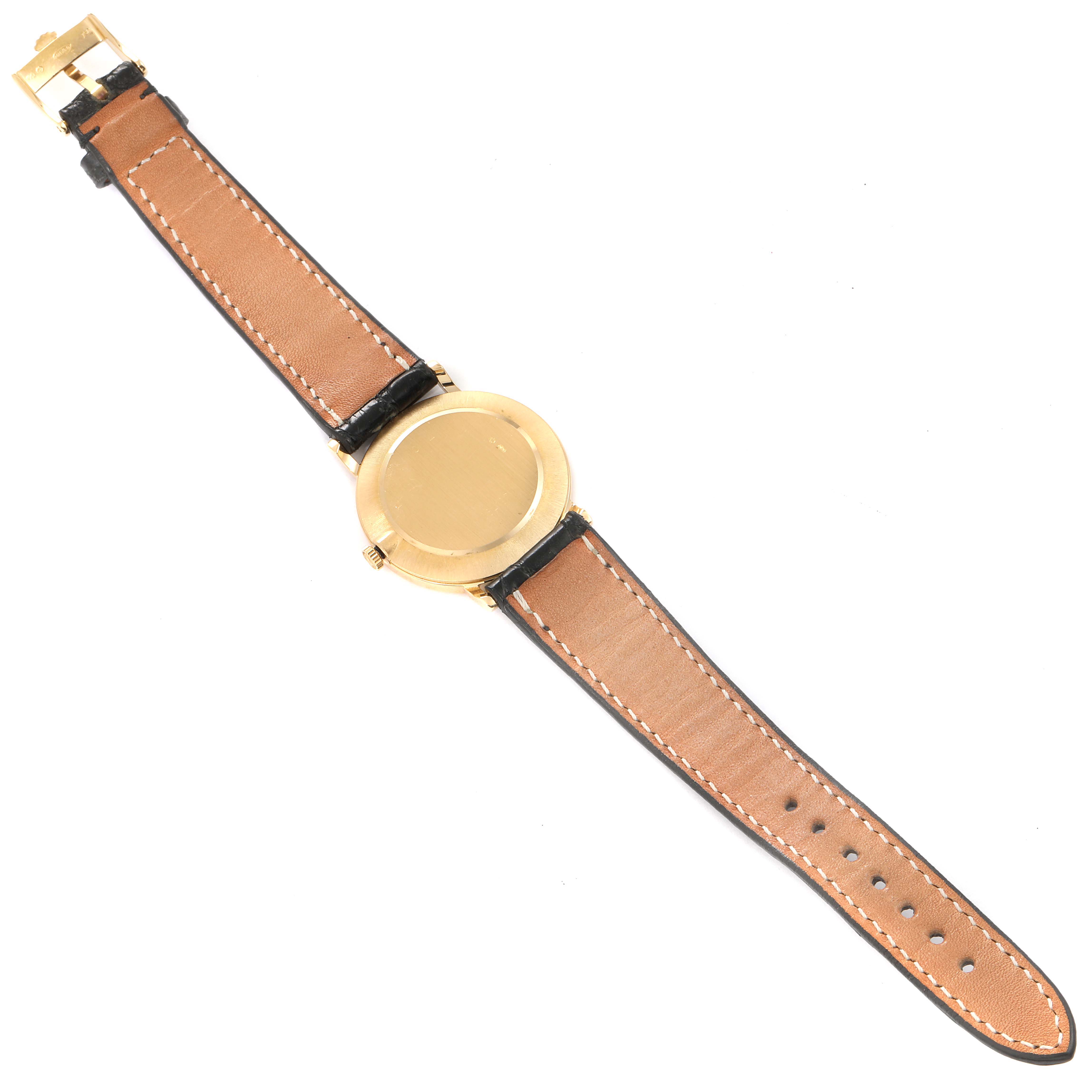 This image shows the back view of a Rolex Cellini 5112 Men's Yellow Gold Beige Dial 5112 Men's Yellow Gold Beige Dial watch, featuring its leather strap and the case back.