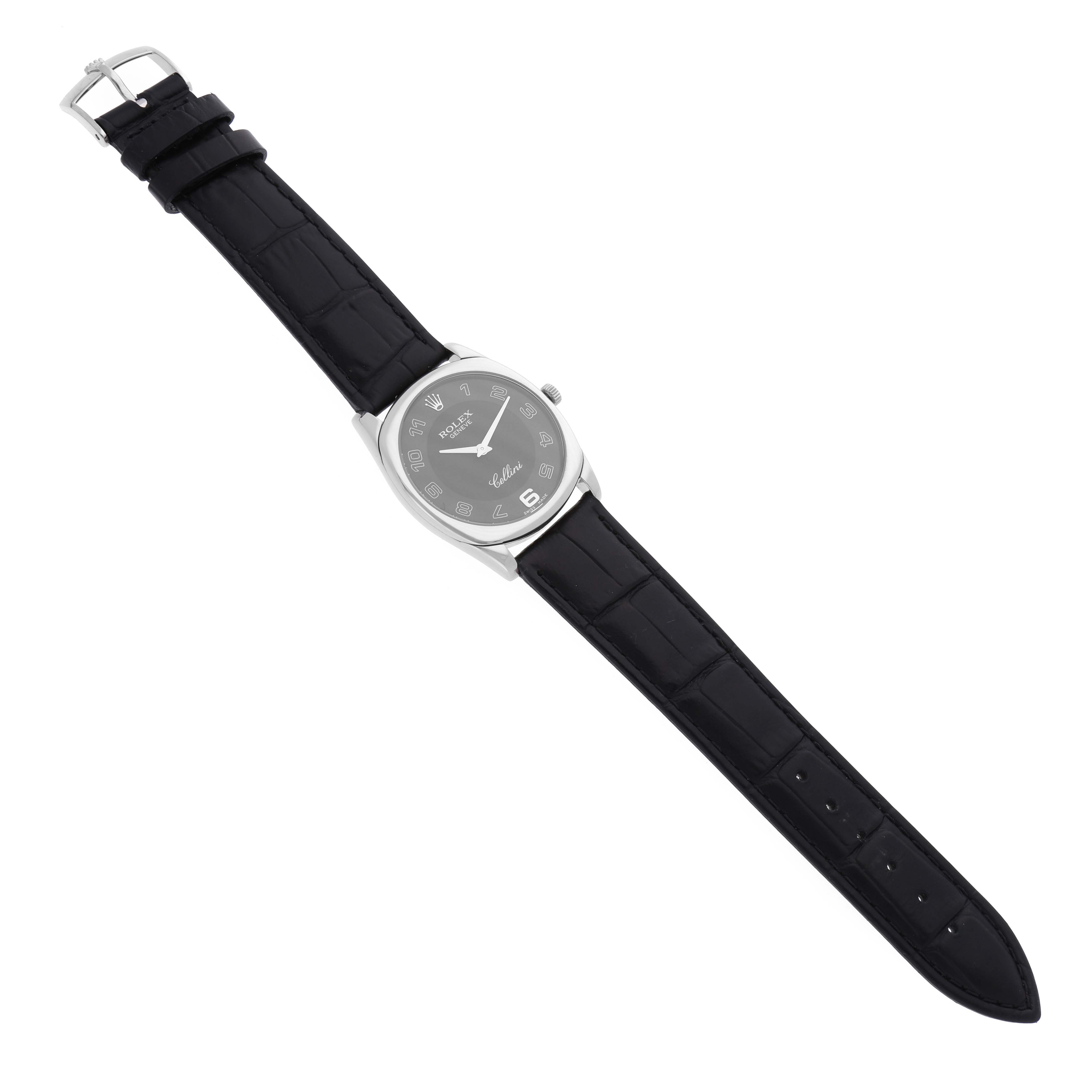 The image shows a top-down angle of a Rolex Cellini 4233 Men's White Gold Black Dial 4233 Men's White Gold Black Dial watch with a black leather strap and a silver-tone case.