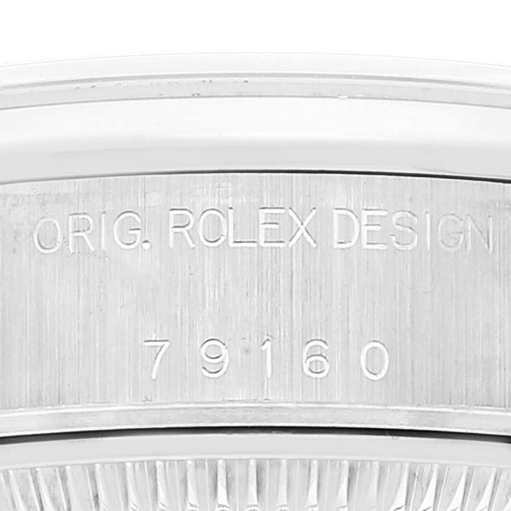 The image shows a close-up of the case side engraving on a Rolex Date 79160 Women's Stainless Steel Silver Dial 79160 Women's Stainless Steel Silver Dial model, featuring the serial number and "ORIG. ROLEX DESIGN".