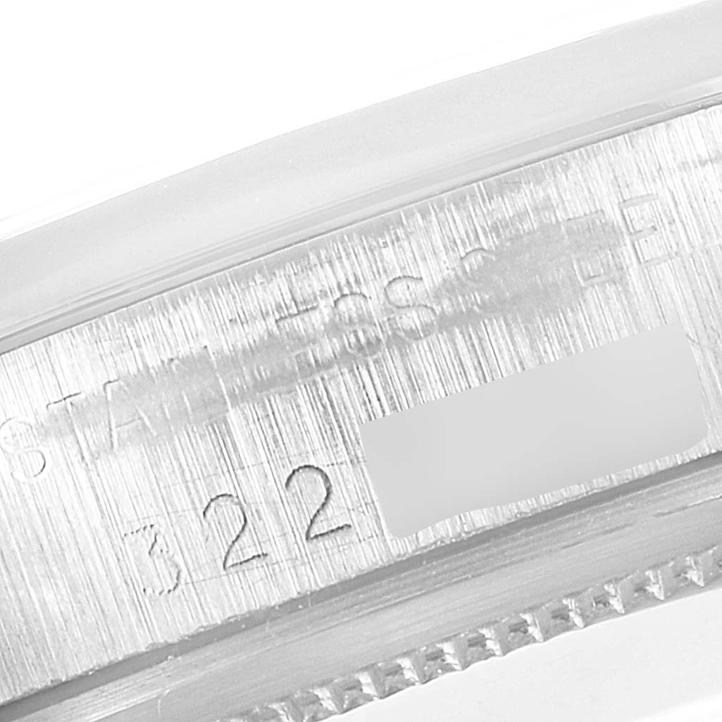The image shows a close-up of the engraving and serial number on the side of a Rolex Vintage Collection 1500 Men's Stainless Steel Black Dial 1500 Men's Stainless Steel Black Dial watch case.