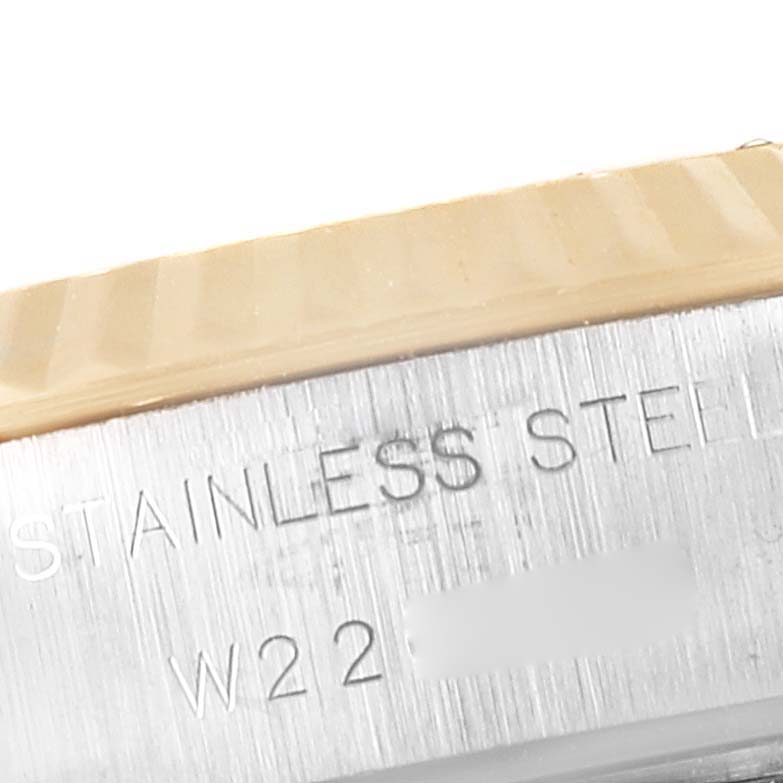 The image shows an angled close-up of the stainless steel case back and the fluted bezel of a Rolex Datejust 69173 Women's Steel and Gold (two tone) Champagne Dial 69173 Women's Steel and Gold (two tone) Champagne Dial watch.