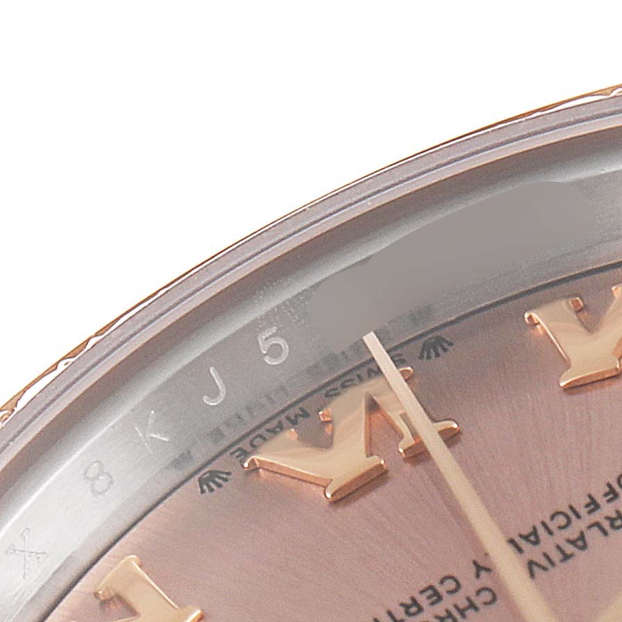 This image shows a close-up of the dial and Roman numerals of a Rolex Datejust 279381 Women's Steel and Gold (two tone) Pink Dial 279381 Women's Steel and Gold (two tone) Pink Dial watch.