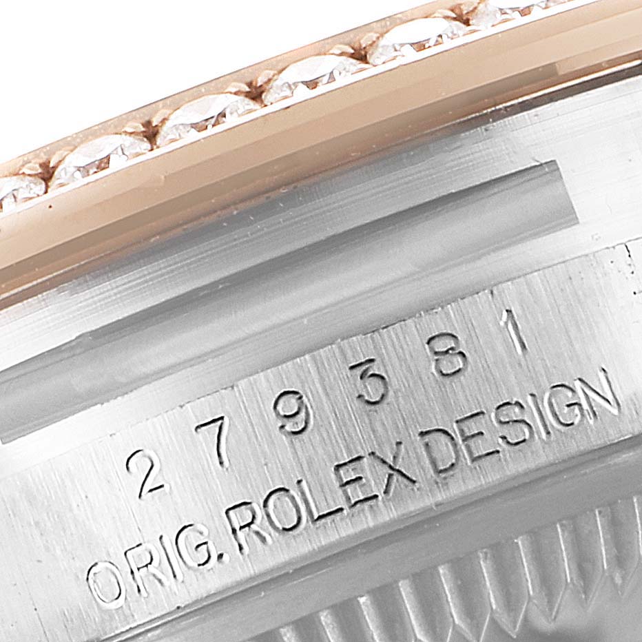 The image shows a close-up view of the engraved bezel and part of the case of a Rolex Datejust 279381 Women's Steel and Gold (two tone) Pink Dial 279381 Women's Steel and Gold (two tone) Pink Dial watch.