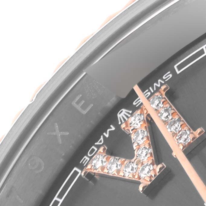 The image shows a close-up of the dial of a Rolex Datejust 126231 Men's Steel and Gold (two tone) Grey Dial 126231 Men's Steel and Gold (two tone) Grey Dial watch, highlighting the "MADE" in "SWISS MADE" and diamond markers on a Roman numeral.