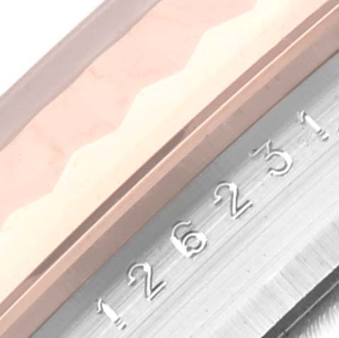 The image shows a close-up of the bezel and dial edge of a Rolex Datejust 126231 Men's Steel and Gold (two tone) Grey Dial 126231 Men's Steel and Gold (two tone) Grey Dial watch, displaying the date wheel with numbers.