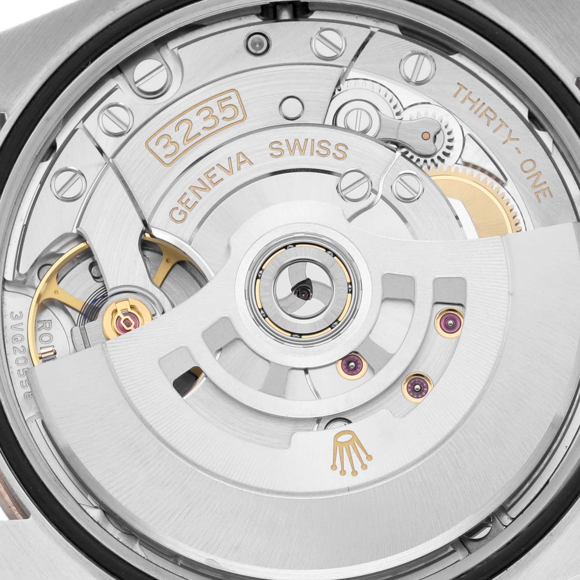 Close-up view of the Rolex Datejust 126231 Men's Steel and Gold (two tone) Grey Dial 126231 Men's Steel and Gold (two tone) Grey Dial's movement and internal mechanics, showing the rotor, gears, and inscriptions.