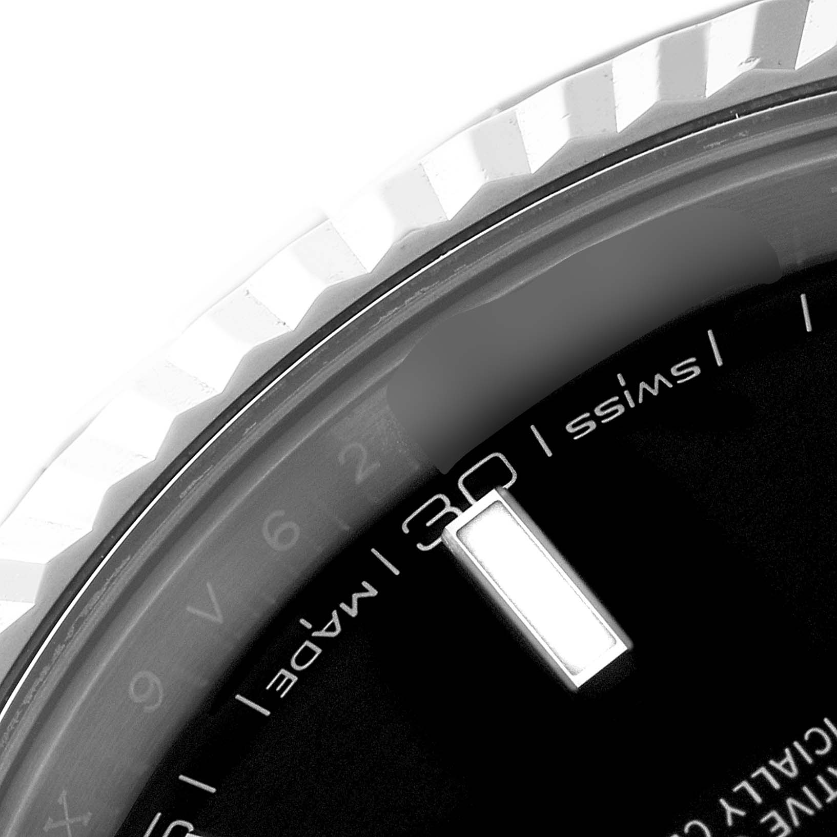 This close-up image shows part of the dial and fluted bezel of a Rolex Datejust 41 126334 Men
s Stainless Steel Black Dial 126334 Men
s Stainless Steel Black Dial watch.