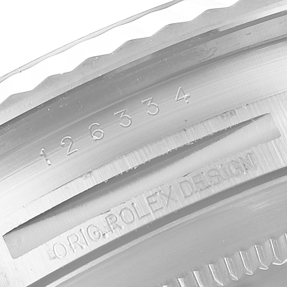 The image shows a close-up of the case side, bezel, and engraved serial number of a Rolex Datejust 41 126334 Men
s Stainless Steel White Dial 126334 Men
s Stainless Steel White Dial.