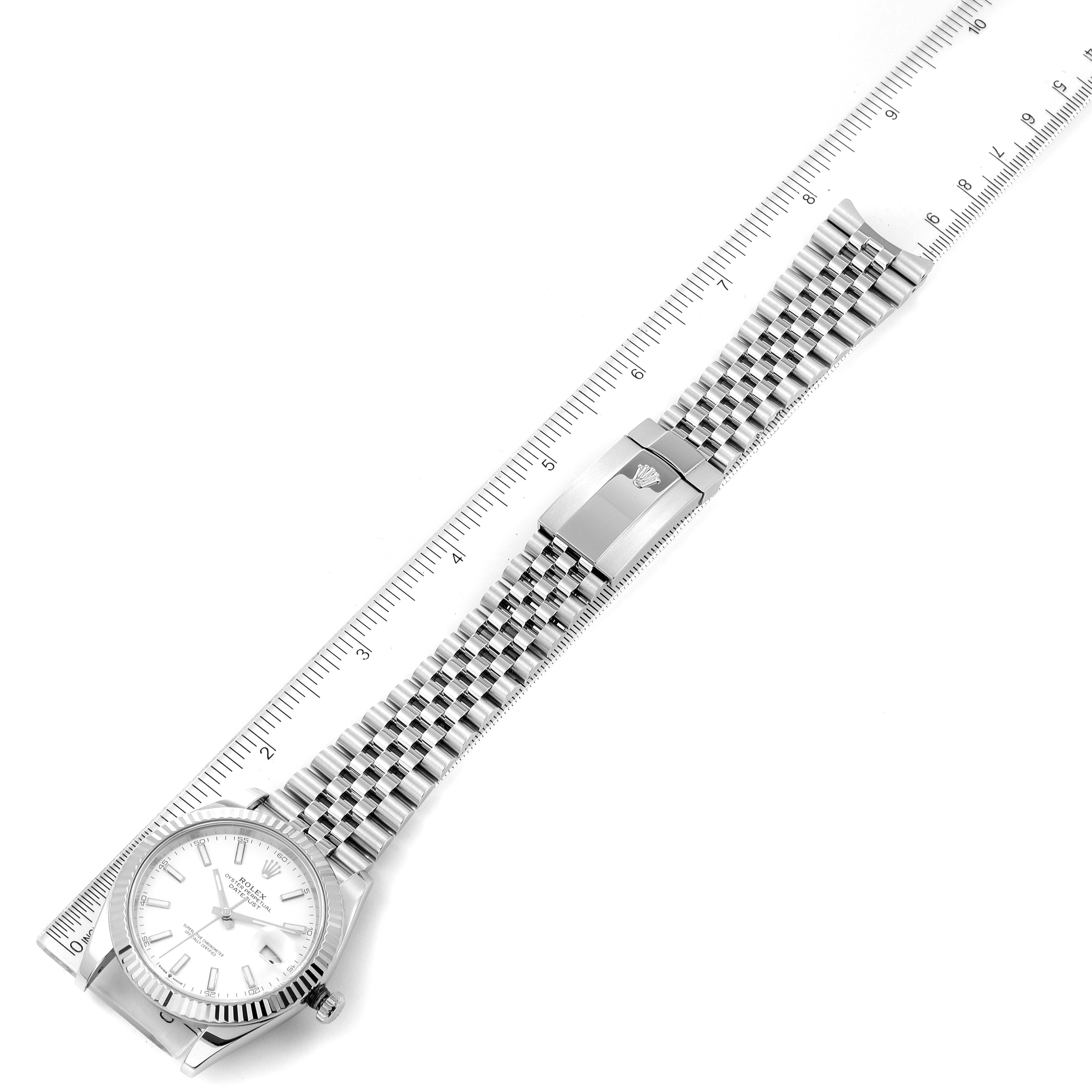 The image shows a top-down view of a Rolex Datejust 41 126334 Men
s Stainless Steel White Dial 126334 Men
s Stainless Steel White Dial watch, including its dial and metal bracelet with a clasp.