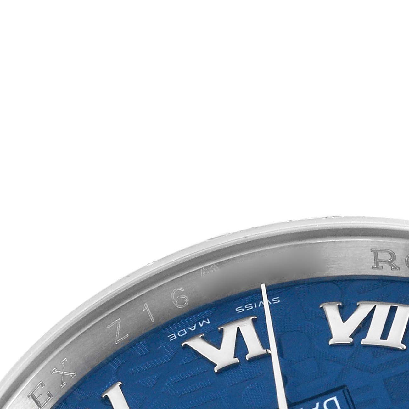 The image shows a partial top-down view of the Rolex Datejust 116200 Men's Stainless Steel Blue Dial, displaying the dial, bezel, and Roman numeral hour markers.