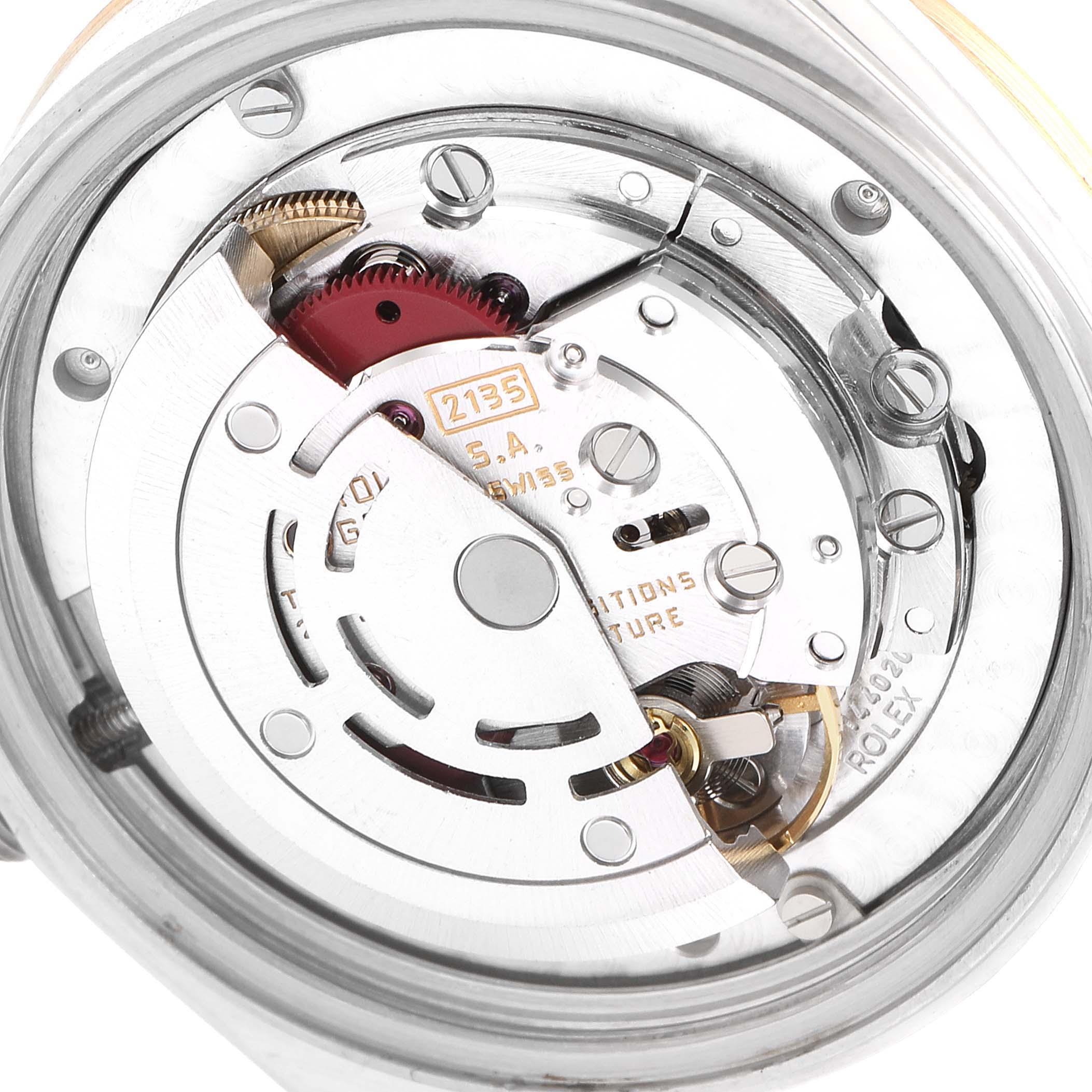 This image shows the internal mechanism of a Rolex Mid-Size 68273 Women's Steel and Gold (two tone) Champagne Dial 68273 Women's Steel and Gold (two tone) Champagne Dial model watch at an angled close-up view, highlighting its intricate components.
