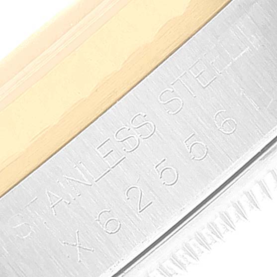 The image shows a close-up angle of the side of a Rolex Datejust 16233 Men's Stainless Steel White Dial 16233 Men's Stainless Steel White Dial watch with "STAINLESS STEEL" and serial numbers engraved.