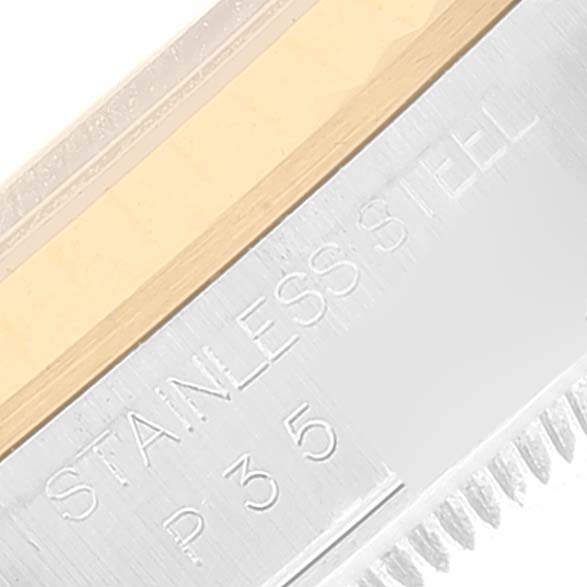 The image shows a close-up angle of the engraved text on the stainless steel case of a Rolex Datejust 16233 Men's Steel and Gold (two tone) Blue Dial 16233 Men's Steel and Gold (two tone) Blue Dial watch.