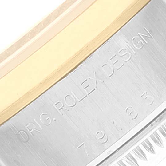 This image shows a close-up of the side of the bezel and case of a Rolex Datejust 79163 Women's Steel and Gold (two tone) White Dial 79163 Women's Steel and Gold (two tone) White Dial watch, highlighting the "ORIG. ROLEX DESIGN" engraving.