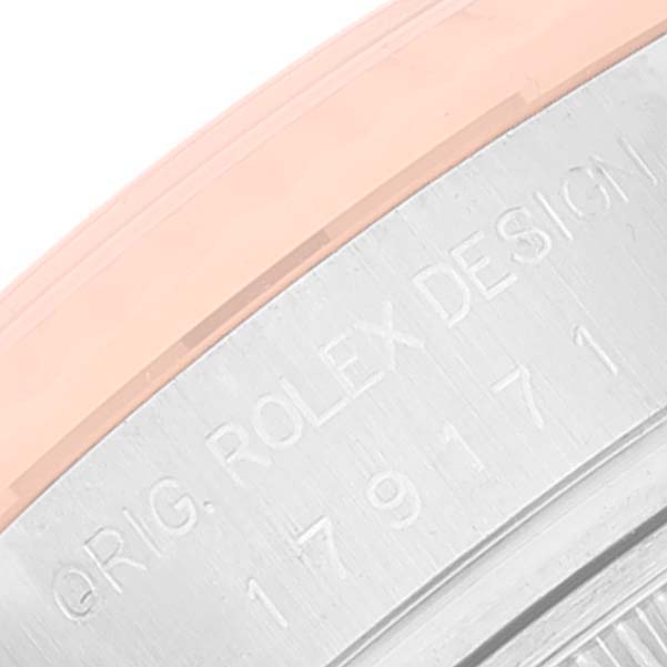 This image shows an angled close-up of the case back rim of a Rolex Datejust 179171 Women's Steel and Gold (two tone) Blue Dial 179171 Women's Steel and Gold (two tone) Blue Dial watch, highlighting the engraved design.