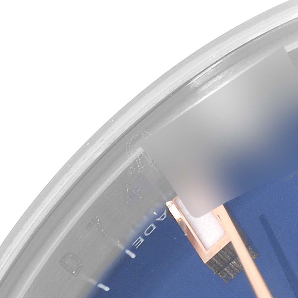 This is a close-up of the Rolex Datejust 179171 Women's Steel and Gold (two tone) Blue Dial 179171 Women's Steel and Gold (two tone) Blue Dial watch, showcasing a portion of the dial and part of the minute hand.