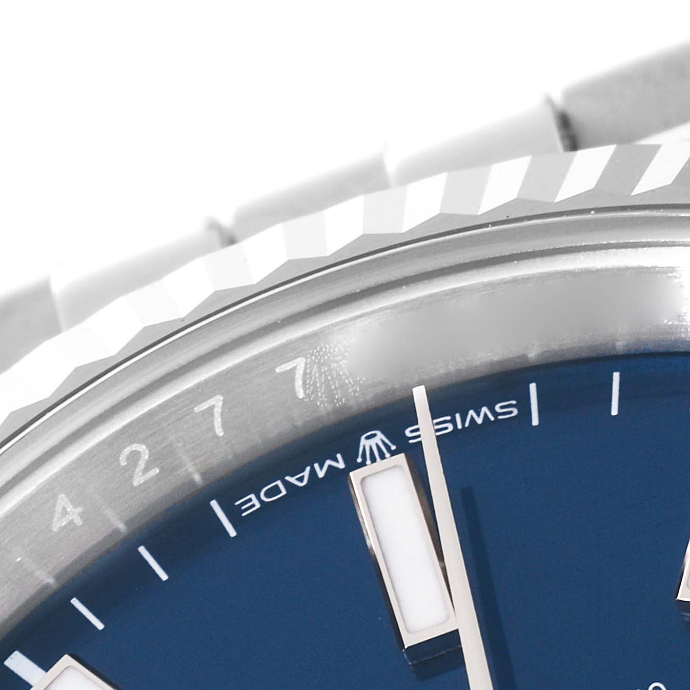 A close-up of the dial, rehaut, and part of the bezel of a Rolex Datejust 46550 Men's Stainless Steel Blue Dial 46550 Men's Stainless Steel Blue Dial watch is shown.