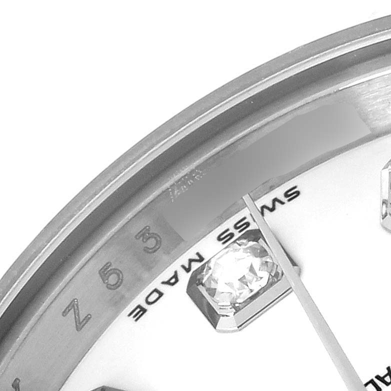 The image shows a close-up of the dial and bezel of a Rolex Datejust 179174 Women
s Stainless Steel White Dial 179174 Women
s Stainless Steel White Dial watch, highlighting the diamond hour marker and "Swiss Made" text.