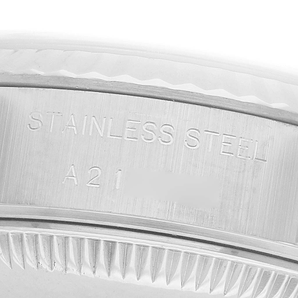 The image shows a close-up of the side engraved with "Stainless Steel" on a Rolex Datejust 79174 Women's Steel and Gold (two tone) Silver Dial watch bezel.