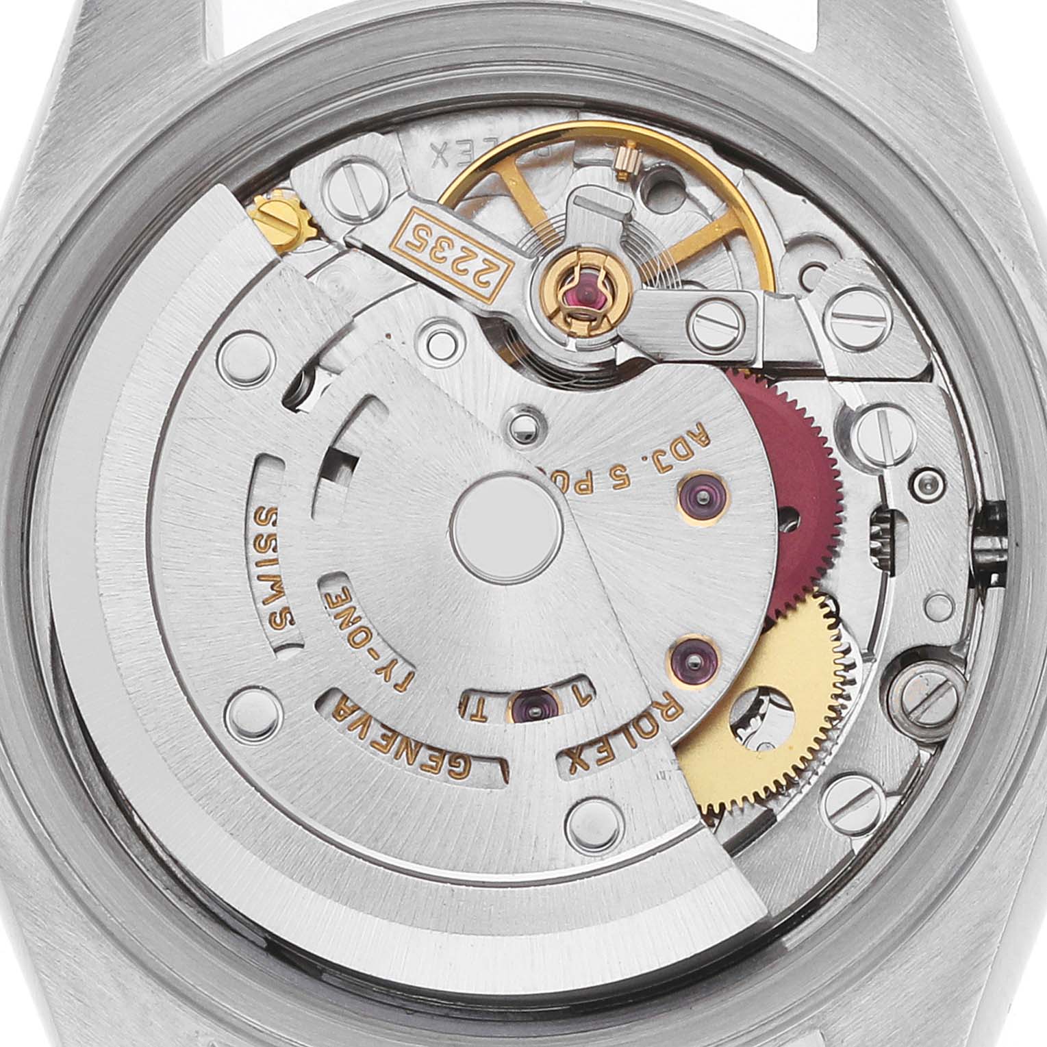 This image shows the movement of a Rolex Datejust 79174 Women's Steel and Gold (two tone) Silver Dial, highlighting its intricate gears and rotor from a top-down angle.