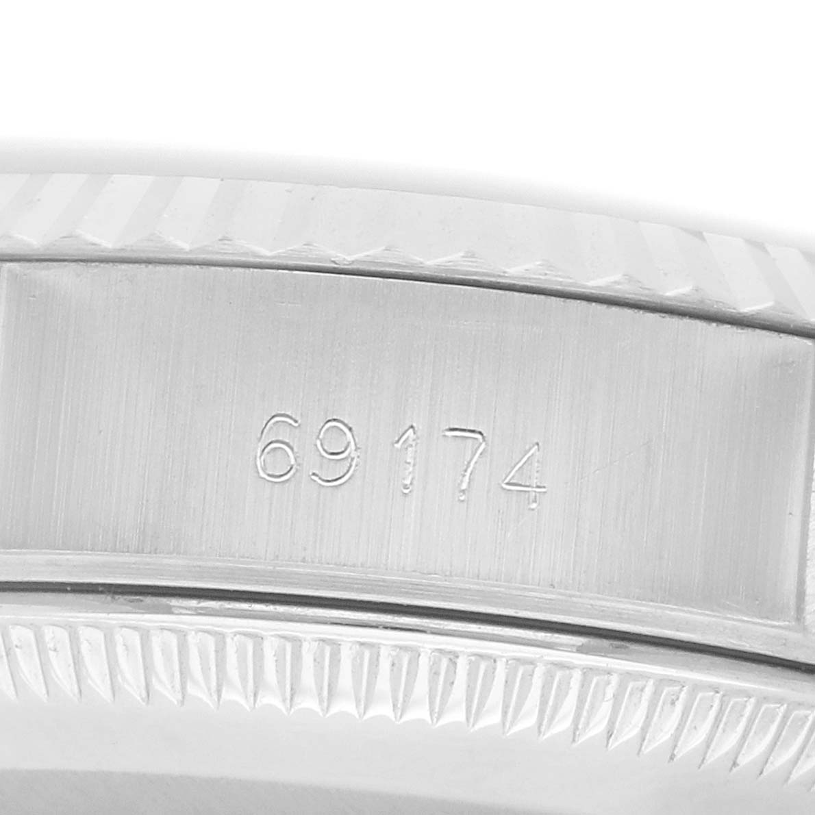 The image shows a close-up of the case side with the reference number engraved on a Rolex Datejust 69174 Women's Stainless Steel Silver Dial watch.