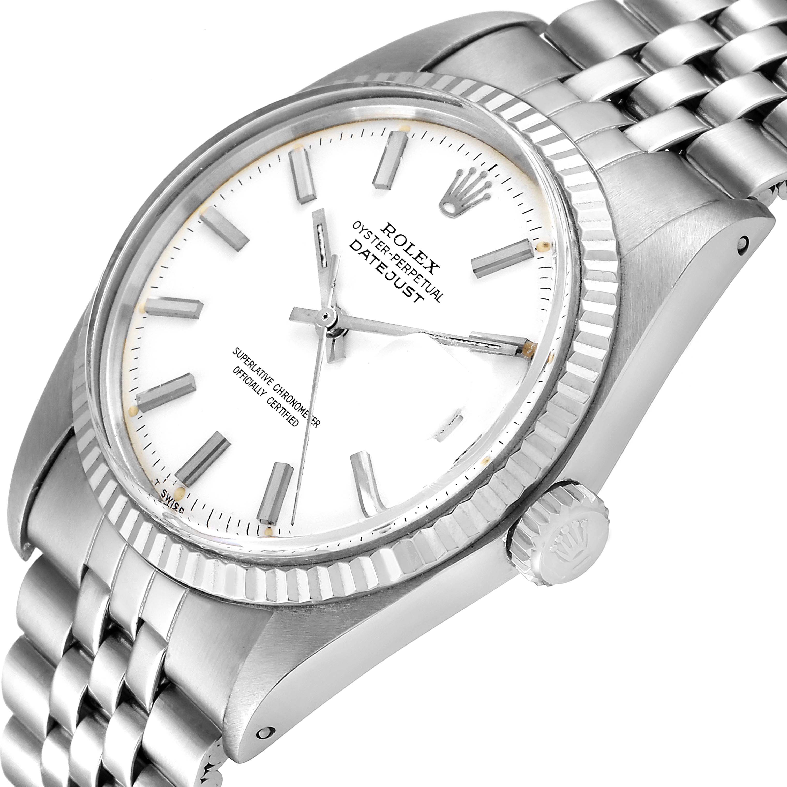The image shows a Rolex Vintage Collection 1601 Men
s Stainless Steel White Dial 1601 Men
s Stainless Steel White Dial Oyster Perpetual Datejust watch at an angled close-up, revealing its dial, bezel, crown, and part of the bracelet.