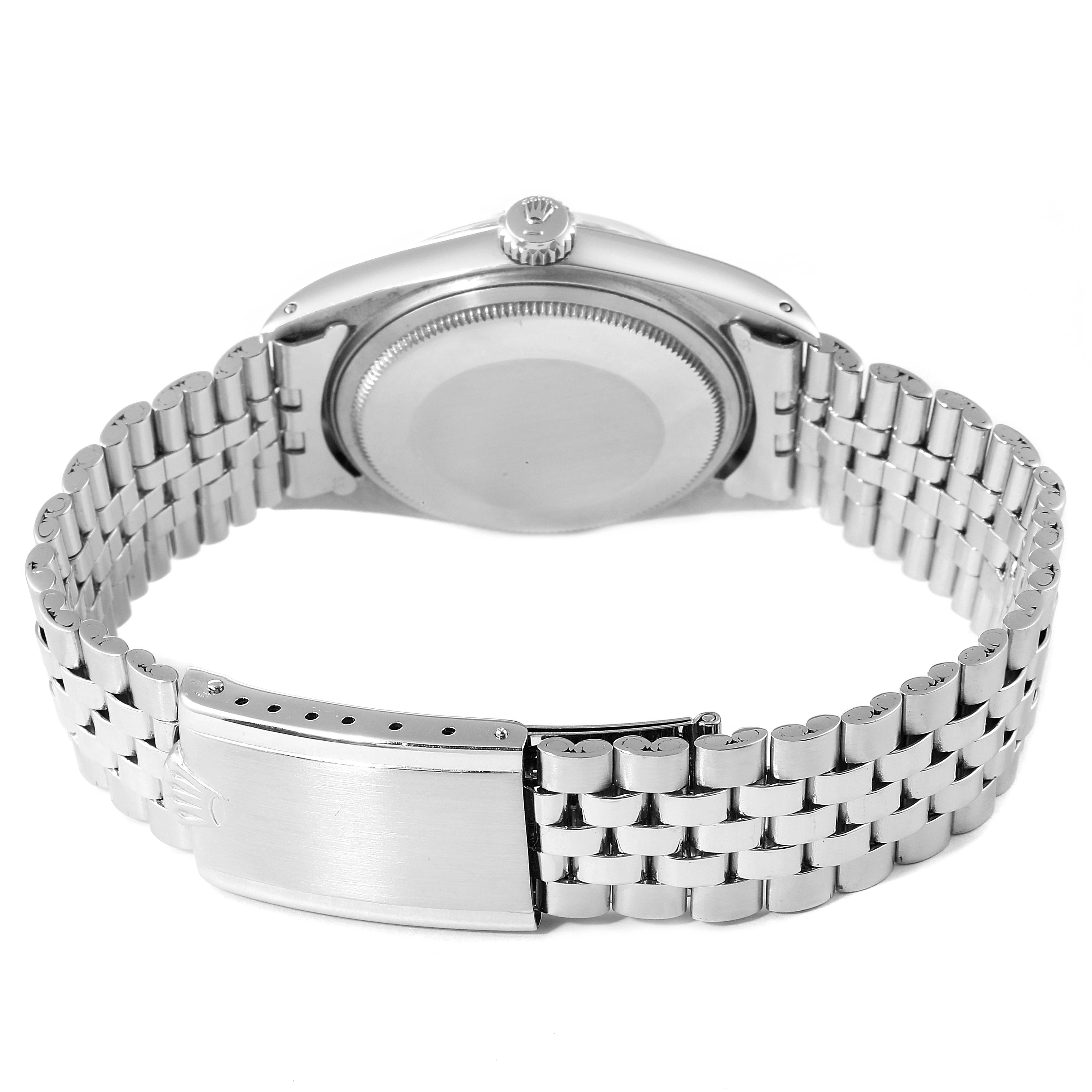 The image shows the back view of the Vintage Collection Rolex watch, focusing on the case back and metal bracelet clasp.