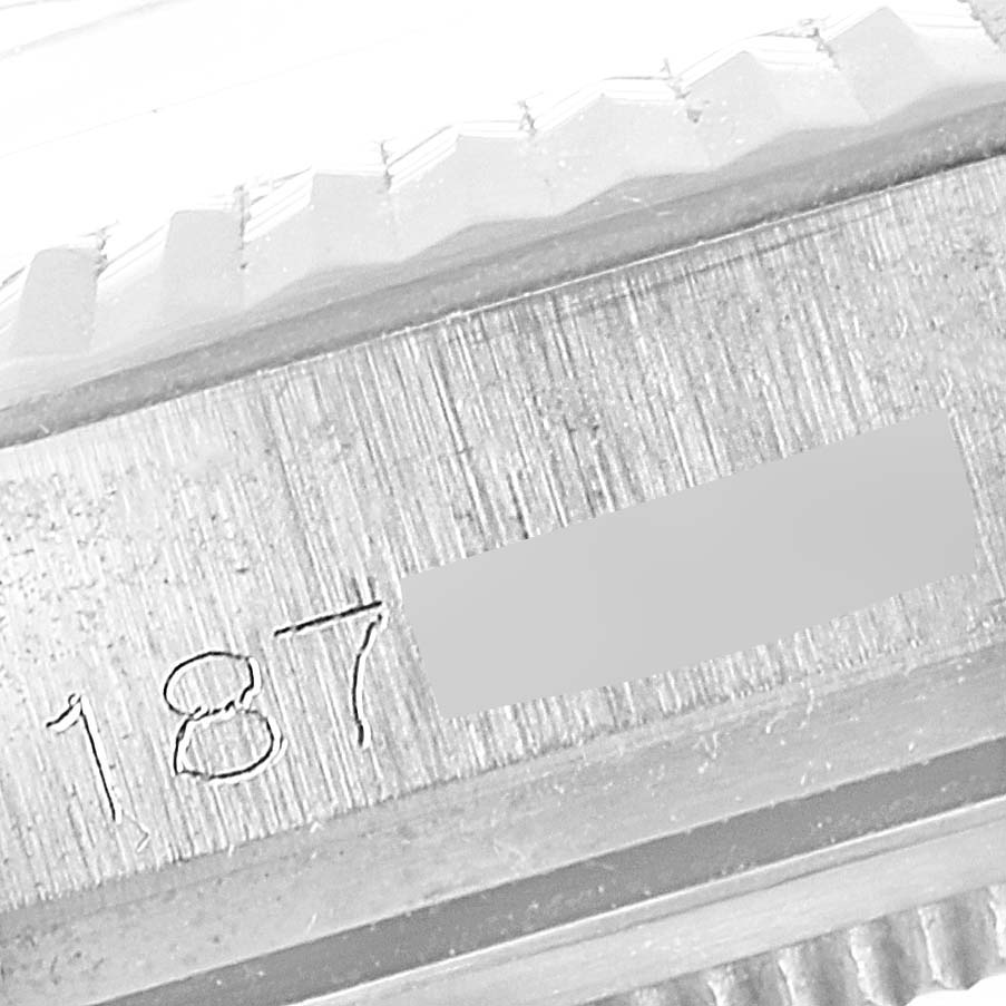 The image shows a close-up of the model and serial number engraving on the case of a Vintage Collection Rolex watch.