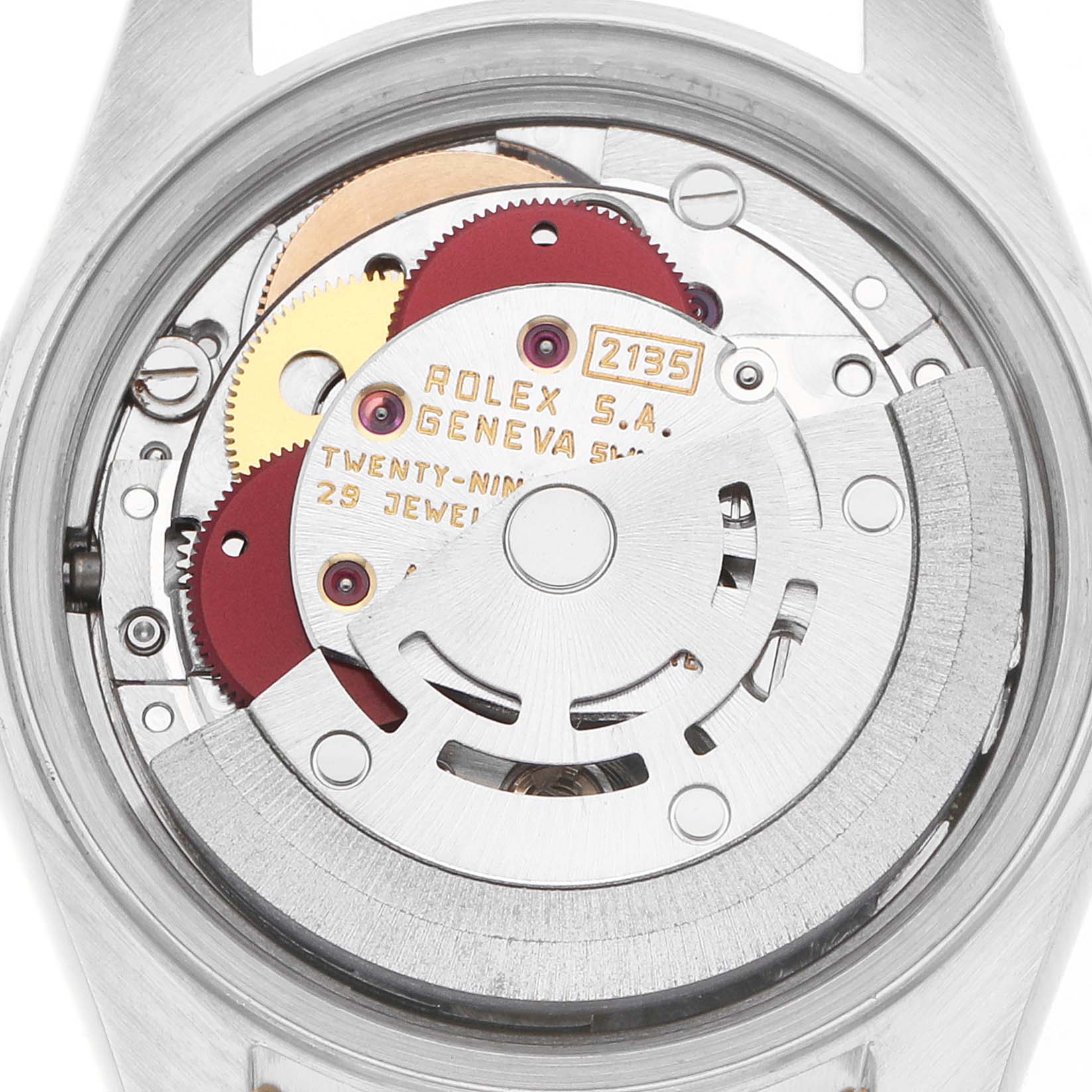 The image shows a close-up of the Rolex Datejust 69173 Women
s Steel and Gold (two tone) Champagne Dial movement, displaying gears and rotor from the back.