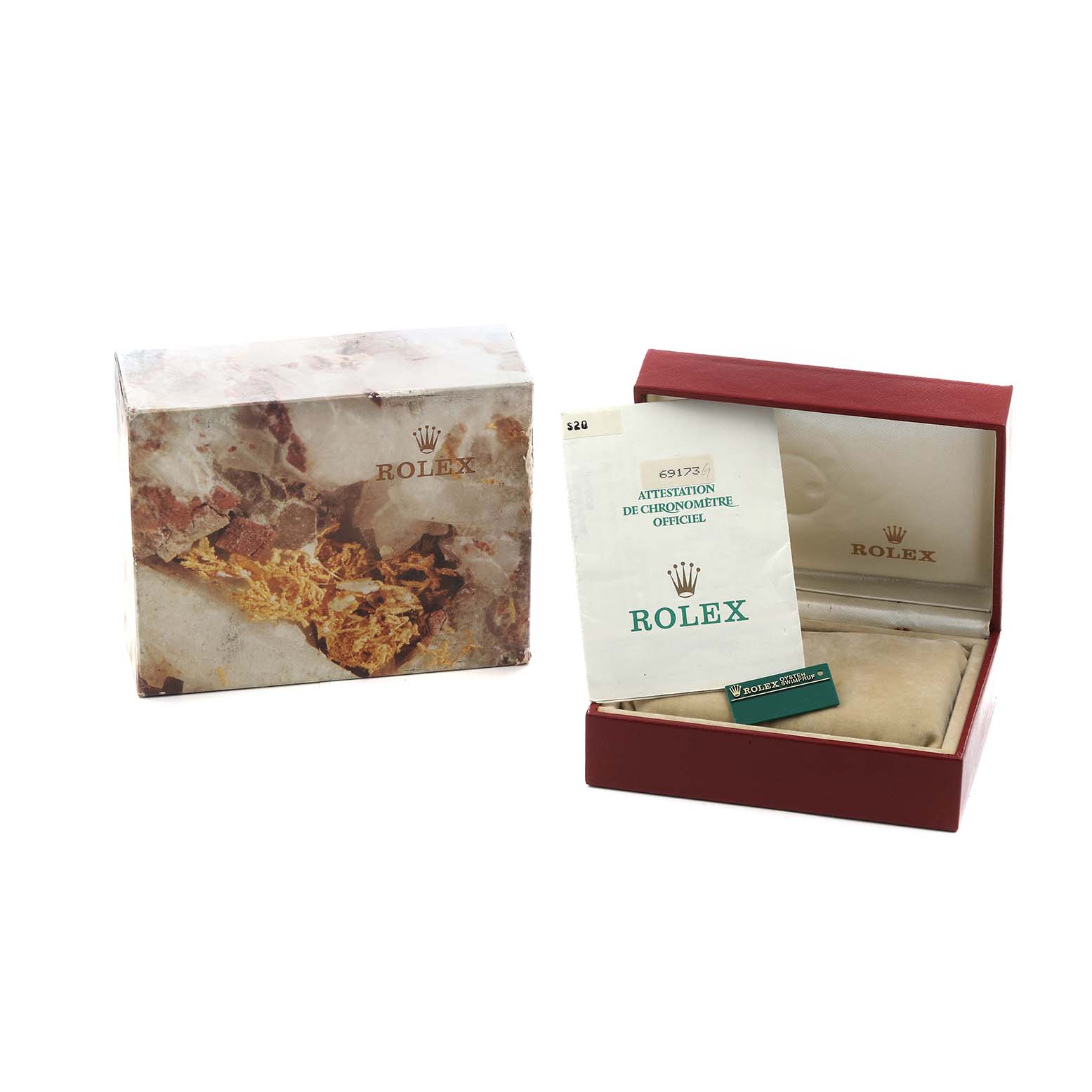 The image shows Rolex Datejust 69173 Women
s Steel and Gold (two tone) Champagne Dial packaging and documents, including a box and warranty papers, angled slightly from the front.