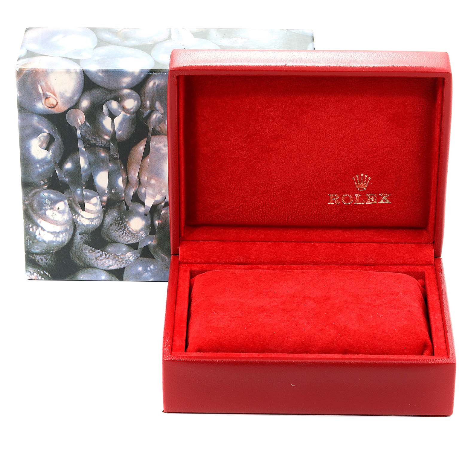 The image shows an open red Rolex box, for the Datejust model, with a cushion inside and the outer packaging in the background.