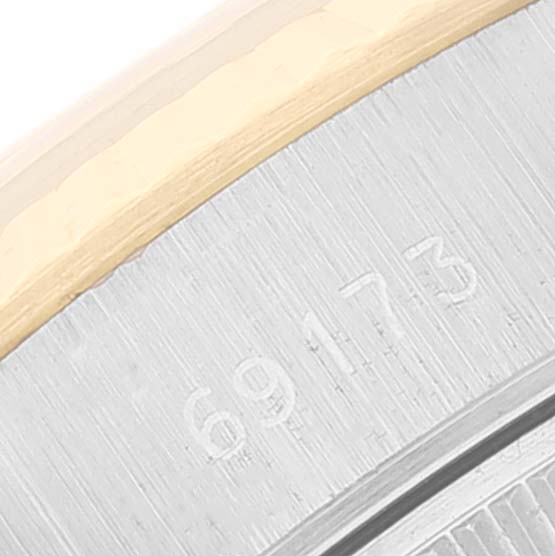 This image shows a close-up of the case back of a Rolex Datejust 69173 Women's Steel and Gold (two tone) Champagne Dial 69173 Women's Steel and Gold (two tone) Champagne Dial model, revealing part of the reference number "69173."
