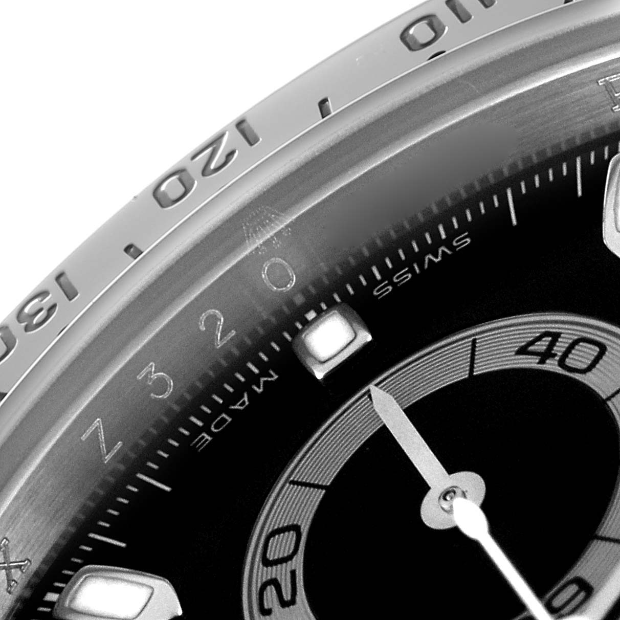 This close-up shows the dial and bezel of the Rolex Daytona 116520 Men's Stainless Steel Black Dial 116520 Men's Stainless Steel Black Dial watch, highlighting its detailed inscriptions.