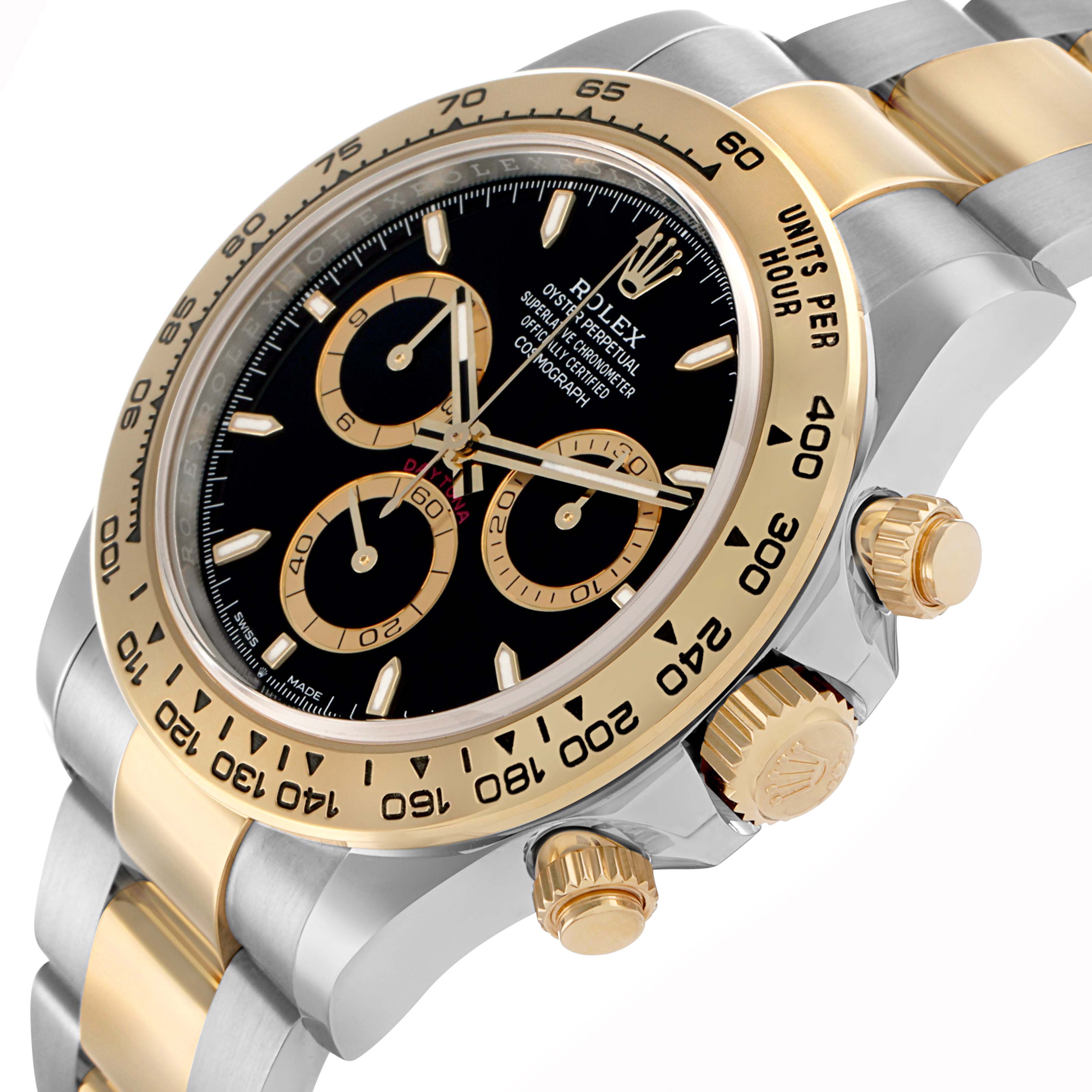 The Rolex Daytona 126503 Men
s Steel and Gold (two tone) Black Dial is shown at an angle highlighting its gold bezel, pushers, crown, and part of the bracelet.